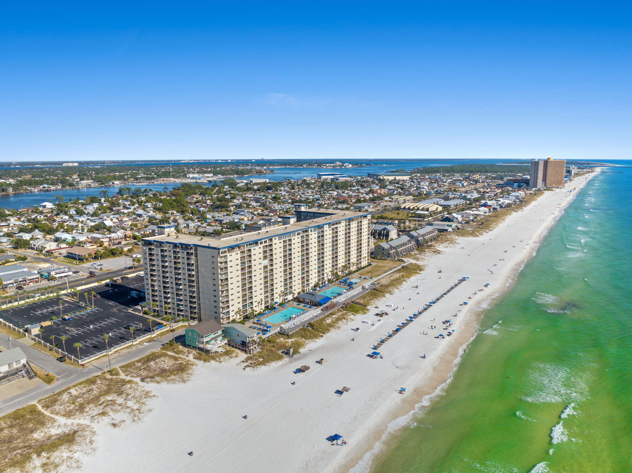 Nice 3 bedroom 2 bath resort condo with a westward view from the main bedroom and balcony.  This is an income producing condo with two swimming pools, hot tub, tiki bar & grill, beach access all for you and your guests enjoyment.