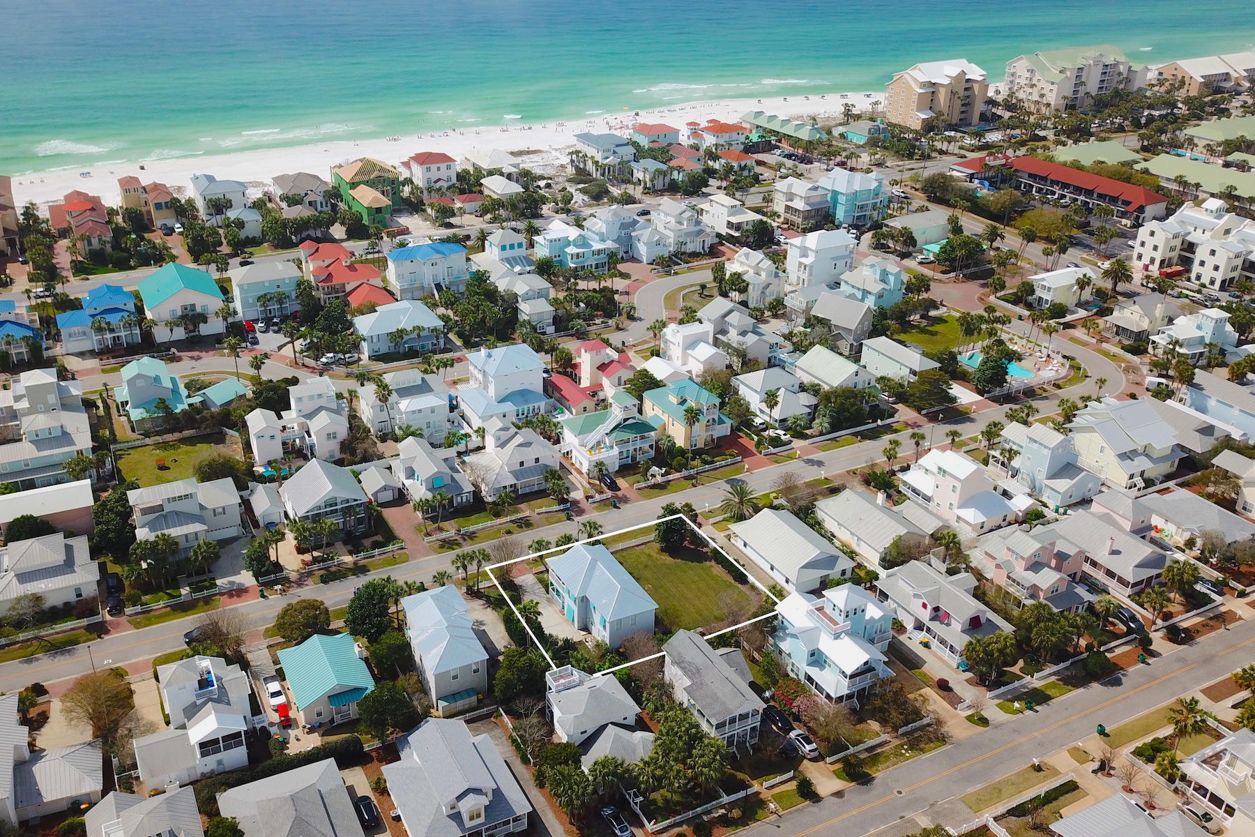 Unique opportunity to own adjoining properties within walking distance to the beach. Life at the beach is most enjoyable from this home located in Crystal Shores in the heart of Crystal Beach. Living and entertaining is simplistic with the open floor plan that is centered around the dining area just beyond the entryway. The stylish kitchen features modern raised panel cabinets, granite countertops, and stainless steel appliances. Upstairs, hardwood flooring adds a rich element to the master and two guest bedrooms. The spacious master bedroom boasts a large bathroom with marble countertops, double vanities, relaxing jetted bathtub and separate walk-in shower. The master bedroom has access to a private wrap-around balcony that overlooks the lushly landscaped yard. Additional features include an outdoor shower, tankless water heater, and hurricane shutters. The Crystal Shores neighborhood pool is steps away and you are just a short distance from the beach access on Hutchinson Street. With convenient access to restaurants, shopping at Destin Commons, and multiple beach accesses, it's easy to see why Crystal Beach is such a sought after location along the coast.