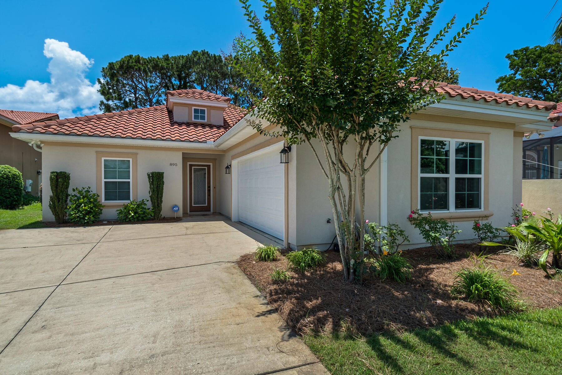 Florida Living at it's Best, in this Golf Course Community with Neighborhood Club House and Pool. Home can be a Short Term Vacation Rental. This 4 Bedroom 3 Bath Patio Home is a Spacious and Open Floorplan, all on one Level and located on the Third Hole of Emerald Bay's gently rolling greens. The large covered patio has spectacular views! This home comes with your very own Golf Cart, ready for year round golfing. Home features are high ceilings, crown molding, travertine flooring, granite counter tops and stainless appliances. Should your heart desire, there is room in the backyard for a pool, just beyond the covered patio. Home shows like New!