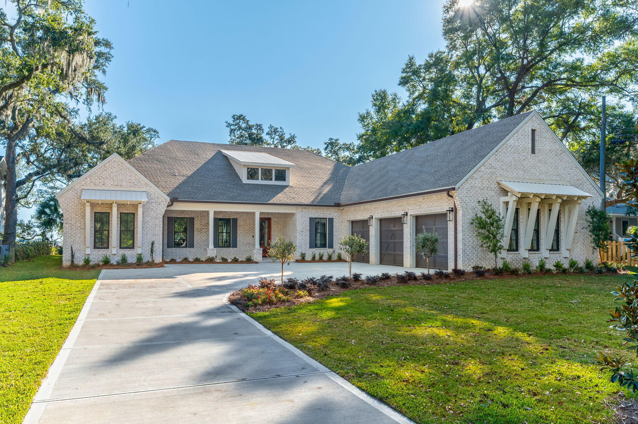 Set beneath a canopy of majestic and historic live oak trees and spanning approximately 90 feet of pristine deep waterfront on a 0.69 acre lot, this 4,176-square-foot brand new custom 2026 built home offers a rare blend of natural beauty, thoughtful design, and refined coastal luxury along the Santa Rosa Sound and Intracoastal Waterway in Mary Esther.

Designed to honor its extraordinary setting, this elegant bayfront home captures sweeping water views from nearly every angle. Upon entry, expansive windows and carefully planned sightlines immediately draw your gaze to the Sound, where shimmering water and ever-changing skies become part of the home's daily rhythm. The open-concept living, dining, and kitchen spaces flow effortlessly together, creating an elegant yet inviting environment ideal for both relaxed living and effortless entertaining. Soaring 12 foot coffered tongue and groove ceilings enhance the sense of space while maintaining warmth with a touch of Southern charm. 

At the heart of the home, the chef's kitchen is a showpiece equipped with top-tier appliances including a six-burner Wolf range, Sub-Zero refrigeration, wine cooler, ice maker, and custom cabinetry. Whether hosting intimate gatherings or large celebrations, the kitchen and adjoining dining area highlighted by a distinctive brick accent wall offer a stunning backdrop of uninterrupted waterfront views.

The primary suite is a true private retreat, thoughtfully positioned in its own wing of the home. Vaulted ceilings, serene bayfront views, and direct access to the back patio create a peaceful escape. The spa-inspired ensuite features spacious dual vanities, a freestanding soaking tub beneath a stunning chandelier, a walk-in glass enclosed shower, private water closet, and an oversized custom closet designed for both form and function.

In total, the home offers four generously sized bedrooms plus a dedicated office, providing flexibility for guests, multigenerational living, or work-from-home needs. This home features a fantastic split floorpan with two primary suites, one in each wing.  Each space is designed with privacy, comfort, and timeless appeal in mind.

Outdoors, the waterfront lifestyle takes center stage. A welcoming outdoor fireplace sets the tone for evenings spent under the oaks, listening to the water and watching spectacular sunsets paint the sky. The expansive backyard offers ample room to add a pool and create a private outdoor oasis, along with space for a dock and boat lift, allowing effortless access to boating, paddle boarding, and life on the Sound. This property offers some of the deepest water in the an area for those who need deep water dockage due to its proximity alongside the channel.

This exceptional custom home is more than a residence--It's a legacy property, offering unparalleled views, historic natural surroundings, and the very best of coastal living. At the front(street side) of the lot, two additional coastal cottages are under construction offering you the possibility of purchasing all three properties if you need a mother in law home or additional investment properties. The additional two homes are not included in this sale and will be sold separately.