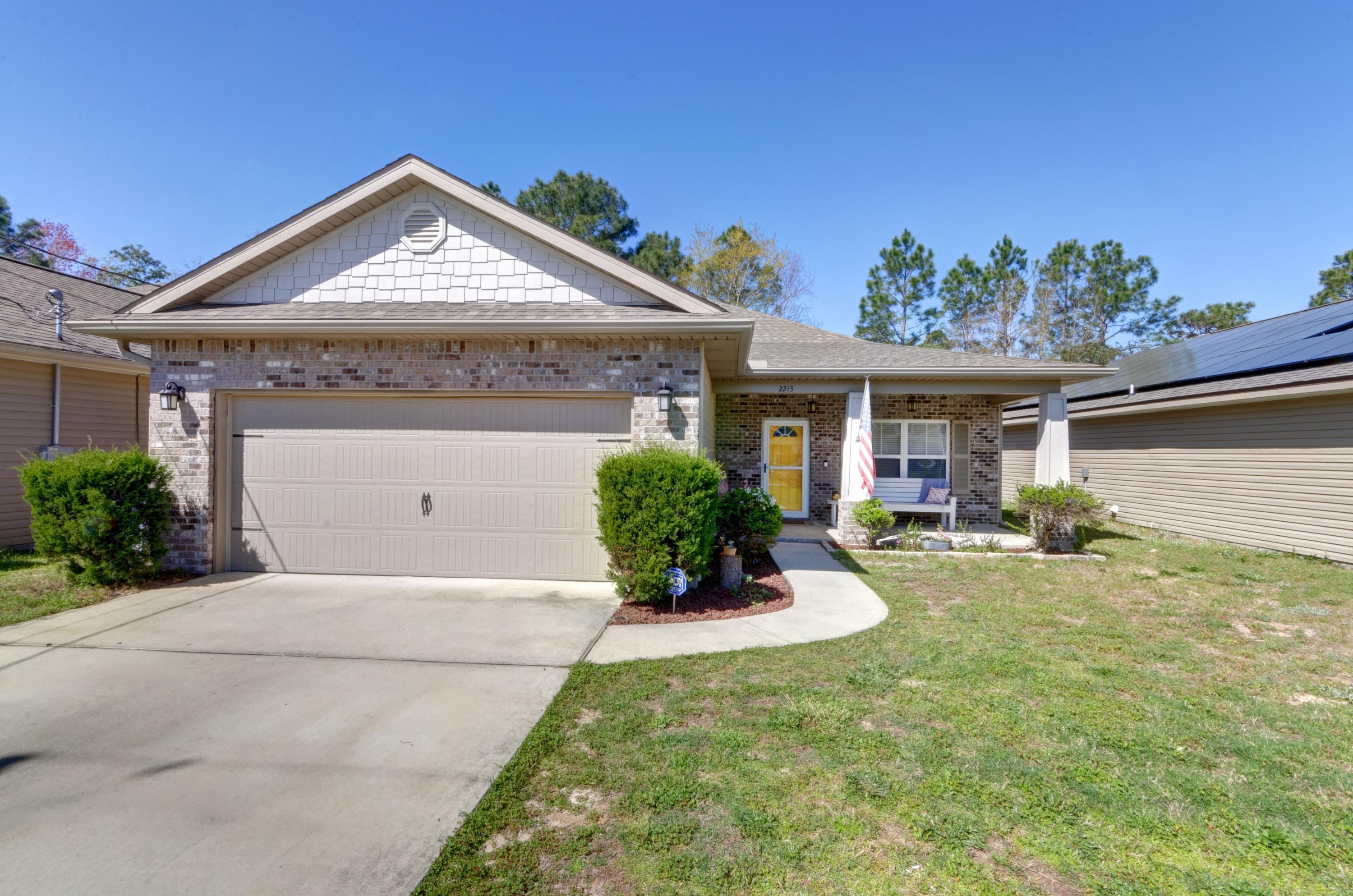 Welcome home to this beautiful custom 3/2 (plus a bonus room!) floor plan in east East Navarre built in just 2016. Just 1 minute past the Santa Rosa County line and a short drive to Hurlburt field, this fantastic location is situated around other newer construction homes. Enjoy features like 10 ft ceilings throughout the main living areas, trey ceilings in the living room and master bedroom, and tile flooring throughout all the common areas. Enter the front door and you'll find the bonus/multipurpose to the right, and crossing over the long foyer you can enter the spacious kitchen to the left. Open to the eat in kitchen space and the massive living room, this open concept kitchen is adorned with custom maple cabinetry, granite countertops, stainless steel appliances, and beautiful accent tile backsplash. The large walk in pantry is located down a hallway that leads to the interior laundry room and then into the two car garage. The master suite also features a custom trey ceiling, and the master bathroom is a dream with double but separated vanities, a private water closet, gorgeous tiled shower, and a luxurious soaking whirlpool tub. The other two bedrooms have ample closet space (one has a massive walk in closet) and they share a great sized bathroom between them with a linen closet. The covered back patio is located off the living room and is enclosed in the fully fenced backyard. Have peace of mind with appliances less than 5 years old and an active termite bond.