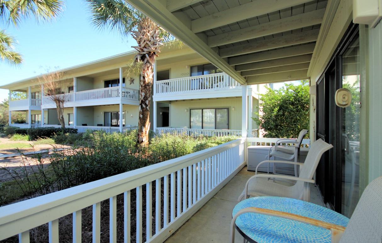 Remodeled Beachwood Villas condo directly across 30A with two public beach accesses.Some of the upgrades to this condo include:Remodeled kitchen with dark cherry cabinets, slow-close hinged drawers, granite counter tops, new stainless steel appliances(under a year old), remodeled bathroom with new sink fixture. Even the furniture is new with the exception of the bedroom. Located on end of building which makes it one of the closest units to the deeded beach access, It is also on ground level, so there are no stairs to climb. The community features 2 swimming pools (1 is heated during winter), tennis courts, shuffleboard, raised wood boardwalks, playground, outdoor cooking areas, clubhouse, and lush landscaping.