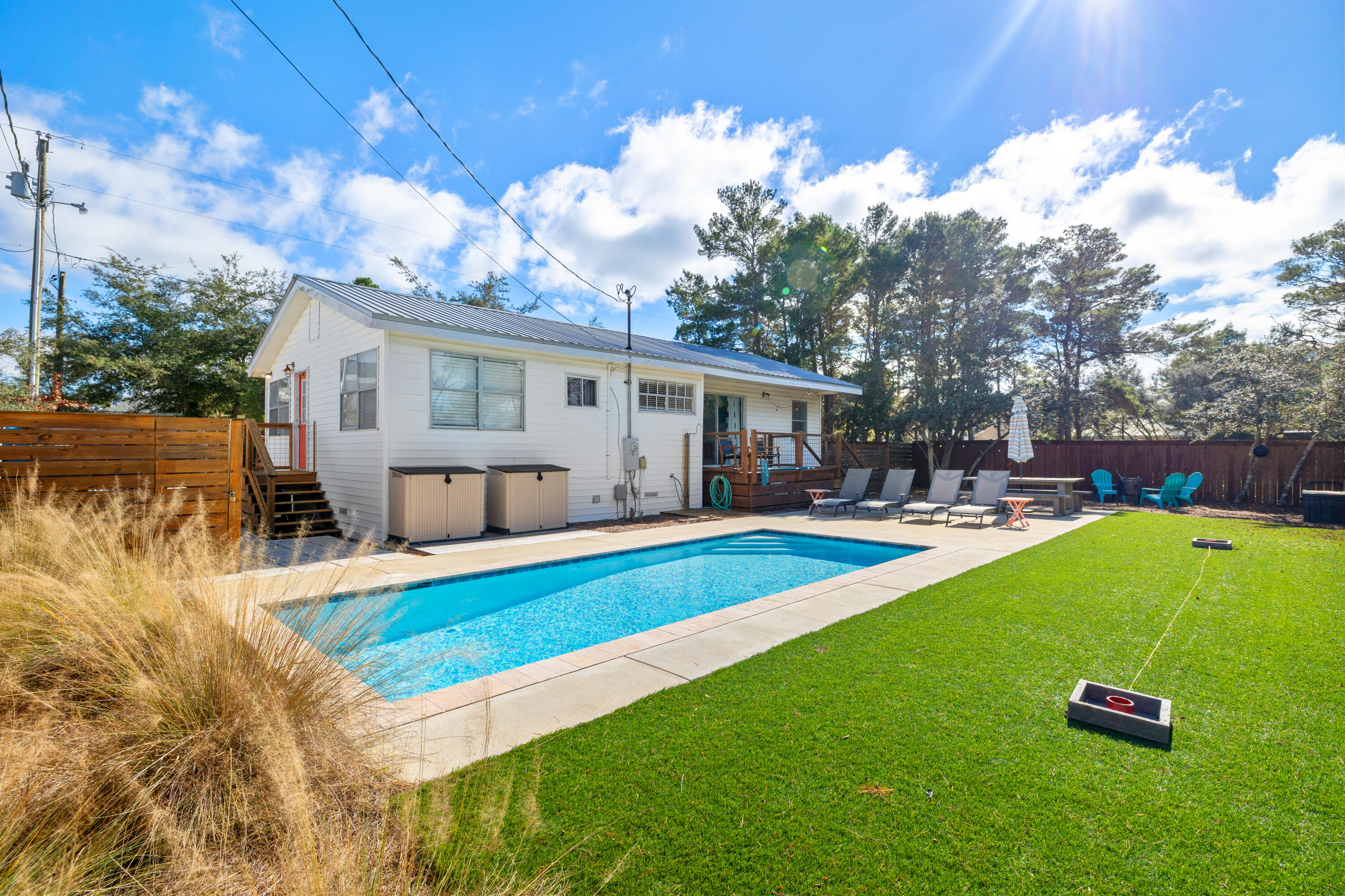 A rare no-HOA coastal retreat designed for effortless luxury and strong rental appeal. This beautifully refreshed home features a private heated and cooled gunite pool, ideal for year-round enjoyment and high guest demand. Located just a short walk to public beach access and an easy bike ride to Seaside, the setting delivers prime 30A lifestyle and convenience. Thoughtful updates enhance comfort, durability, and efficiency, while light coastal finishes create a relaxed yet elevated atmosphere. Outdoor living shines with rebuilt decks and a resort-style pool perfect for entertaining. Ideal as a second home or income-producing property, this is coastal ownership without restrictions--just steps from sand, sea, and iconic amenities.