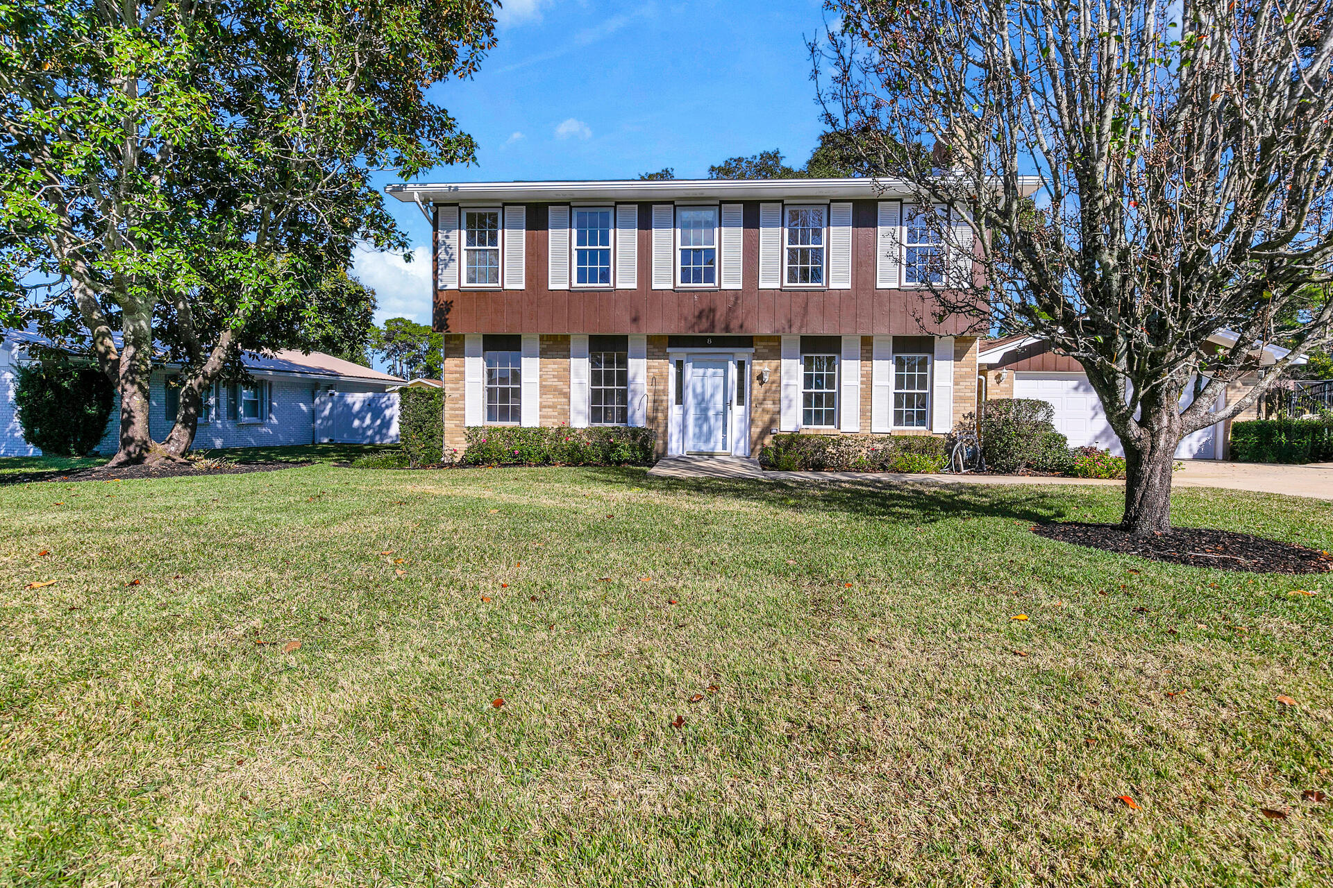 PRICE ADJUSTMENT on RENOVATED home in the Lake Lorraine area of Shalimar is ready and waiting for its lucky new owners! This traditional style home on a roomy .26 acre fenced lot has been recently updated to include new wiring, solid hardwood bamboo and tile flooring, light fixtures, fans, paint and updated baths! Downstairs you will find a large family room as well as a combined living and dining room area offering plenty of living space with access to the back yard patio through double French doors. The kitchen is adjacent to both the dining room and family room and it has a convenient door leading to the great back yard as well. The master suite, 3 additional bedrooms and another full bath are upstairs. The back yard features a yard building for extra storage and there is an attached two car garage as well. Additional noteworthy features include 2020 roof, 2015 HVAC systems, almost all new windows, a new electric fireplace, a sprinkler system with a lawn pump and a recently serviced whole house GENERAC generator .  This home is truly MOVE IN READY and can be yours to love!