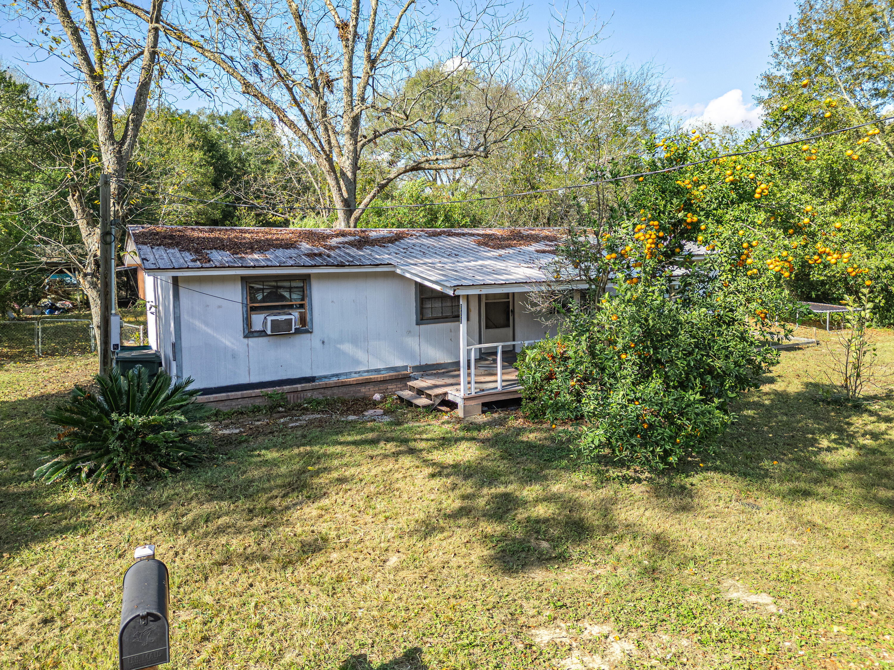 Don't miss out on this amazing chance to own a home in a peaceful residential area of Defuniak Springs. This property comes with a spacious plot of land. From the mailbox, you can catch a glimpse of the beautiful Lake Stanley, which is fed by natural springs. The lake is 16 feet deep and features amenities such as public restrooms, picnic tables, a playground, and a pier for your leisure. Although this house requires some repairs, it has incredible potential.