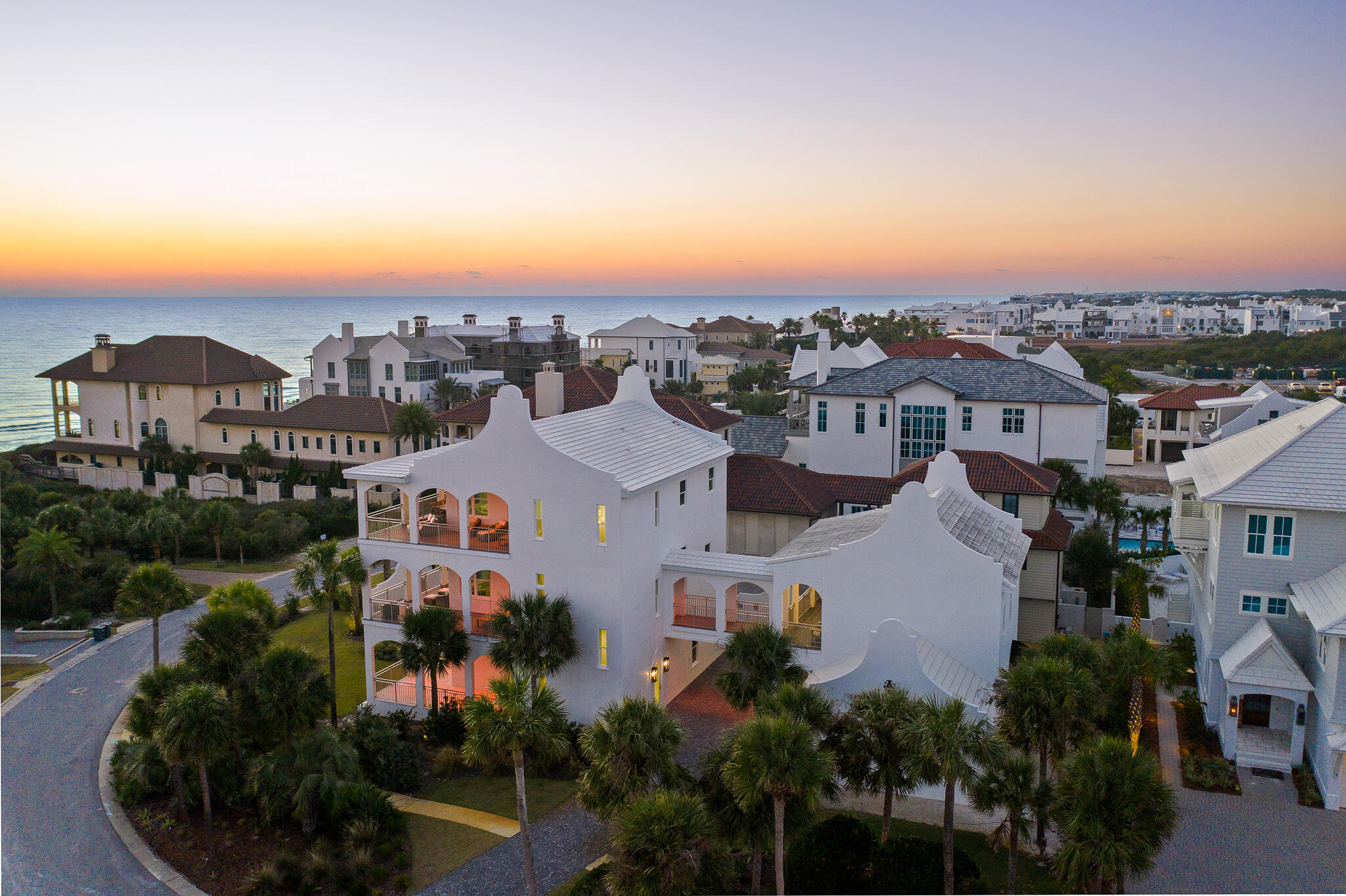Stunning sunsets & gulf views await from this 2nd tier home in Paradise By The Sea.  A controlled access community, Paradise By The Sea is easily walkable to the many shops, restaurants, coffee shops, wine bars of Alys Beach and Rosemary Beach.  To make the most of the views, the grand kitchen and expansive living area are located on the top floor, easily accessible via the elevator or the stairs.  Outdoor living is in the forefront too with large, covered balconies on each level including a pool, fireplace and summer kitchen on the first level.  Plenty of parking, a one car garage plus a two car garage that has been converted into a heated and cooled play area for the youngsters and the young at heart.  The carriage house is connected via a 2nd level walkway to the main house and also has a private entry from the ground floor.  Peaceful and serene with a healthy dose of coastal elegance are the hallmarks of this stunning beach home.