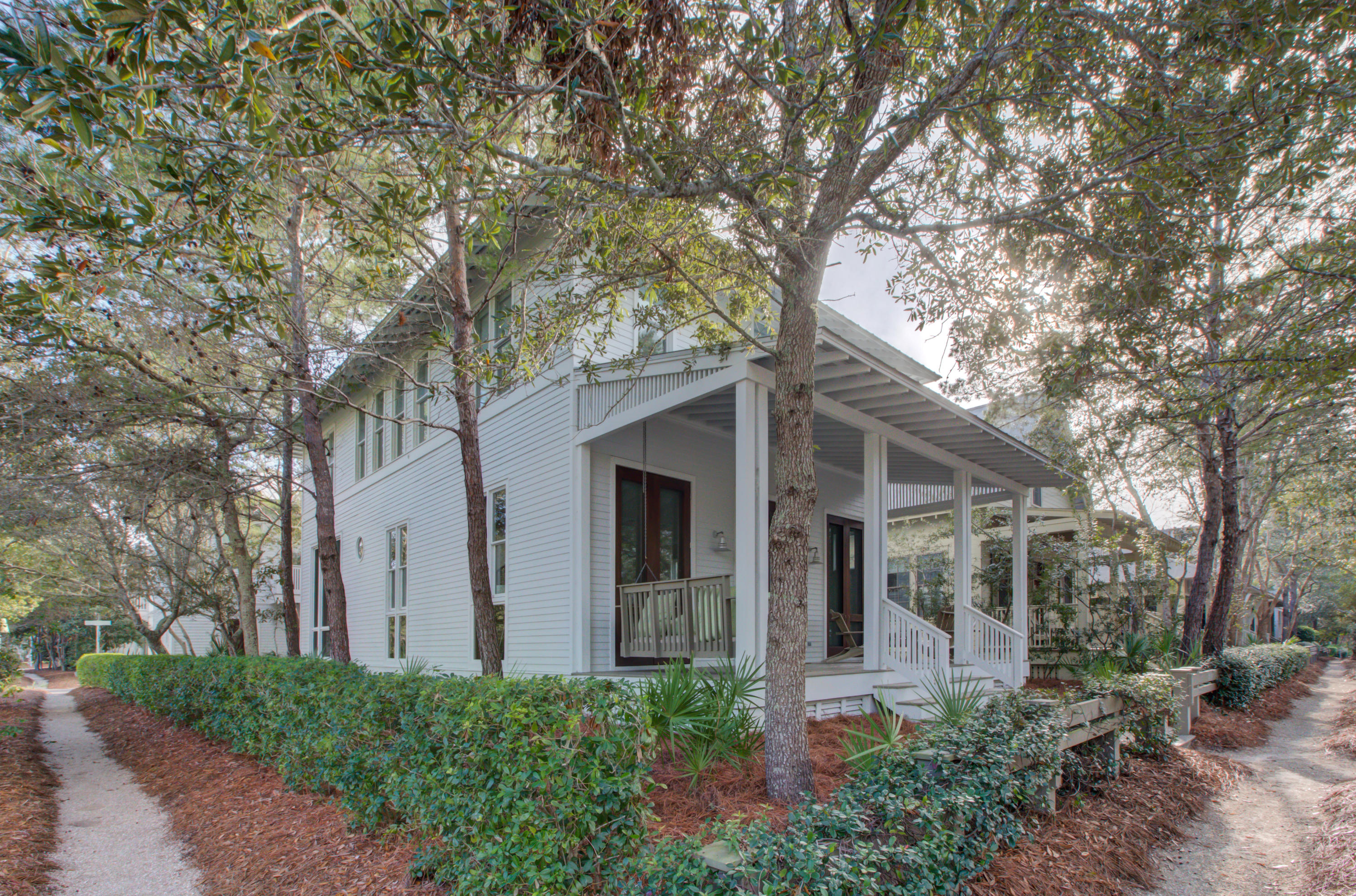 This professionally decorated, fully furnished home features an airy contemporary coastal design throughout. Ideally located on a large corner lot in WaterColor's Phase I Park District, this property is just steps to the WaterColor Beach Club and town center. This thoughtfully designed home offers a main residence and a detached carriage house with 2 car garage and separate living quarters above. The main home features hardwood flooring throughout, a spacious great room with soaring ceilings, floor to ceiling windows, a cozy fireplace, large dining, gaming area and kitchen with ample storage that opens to the screened in outdoor dining area,. The second level is highlighted by two spacious master suites with private baths, an additional bedroom and a full bathroom. The carriage house features an open concept design with a living area, dining area, kitchen, a king size bedroom and full bath. The exterior space is built to entertain featuring expansive open and screened porches, shower, outdoor dining, plenty of space for grilling and family fun. Centrally located to the best dining, unique boutique shopping, bike paths and some of the most challenging golf courses the gulf coast has to offer. WaterColor is a vibrant beach resort and residential community tucked between the beautiful beaches of the Emerald Coast and Western Lake, a natural 220-acre coastal lake. WaterColor amenities; a full service Beach Club, 5 pools, miles of trails for hiking or biking, town center, tennis center, you can also enjoy paddle boarding and kayaking at the BoatHouse. Perfect for an investment property. Call for more details!