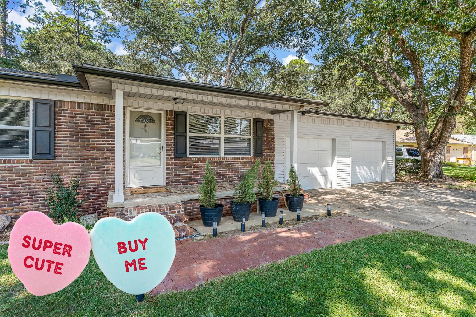 AFFORDABLE and MOVE- IN READY!  Don't miss this home with the character of original wood floors and updates you'll appreciate!  The interior walls, baseboards and doors have just been freshly painted.  The main bathroom was completely renovated (2023) with a glass/tile walk in shower, new floors, fixtures and shiplap wall.  Bonus - plenty of HOT water from the tankless water heater (2018).  The eat-in kitchen leads out to a spacious backyard with full privacy fence.  There's plenty of space for dogs, gardens, a POOL and more!  Take note of these updates - roof 2018, electrical 2018 & 2025 and gutters 2022.  Plus, the washer and gas dryer stay for you!   Work from home?  Live Oak Fiber and AT&T Fiber are available for excellent connectivity.  The oversized garage (26x29) has high ceilings.
