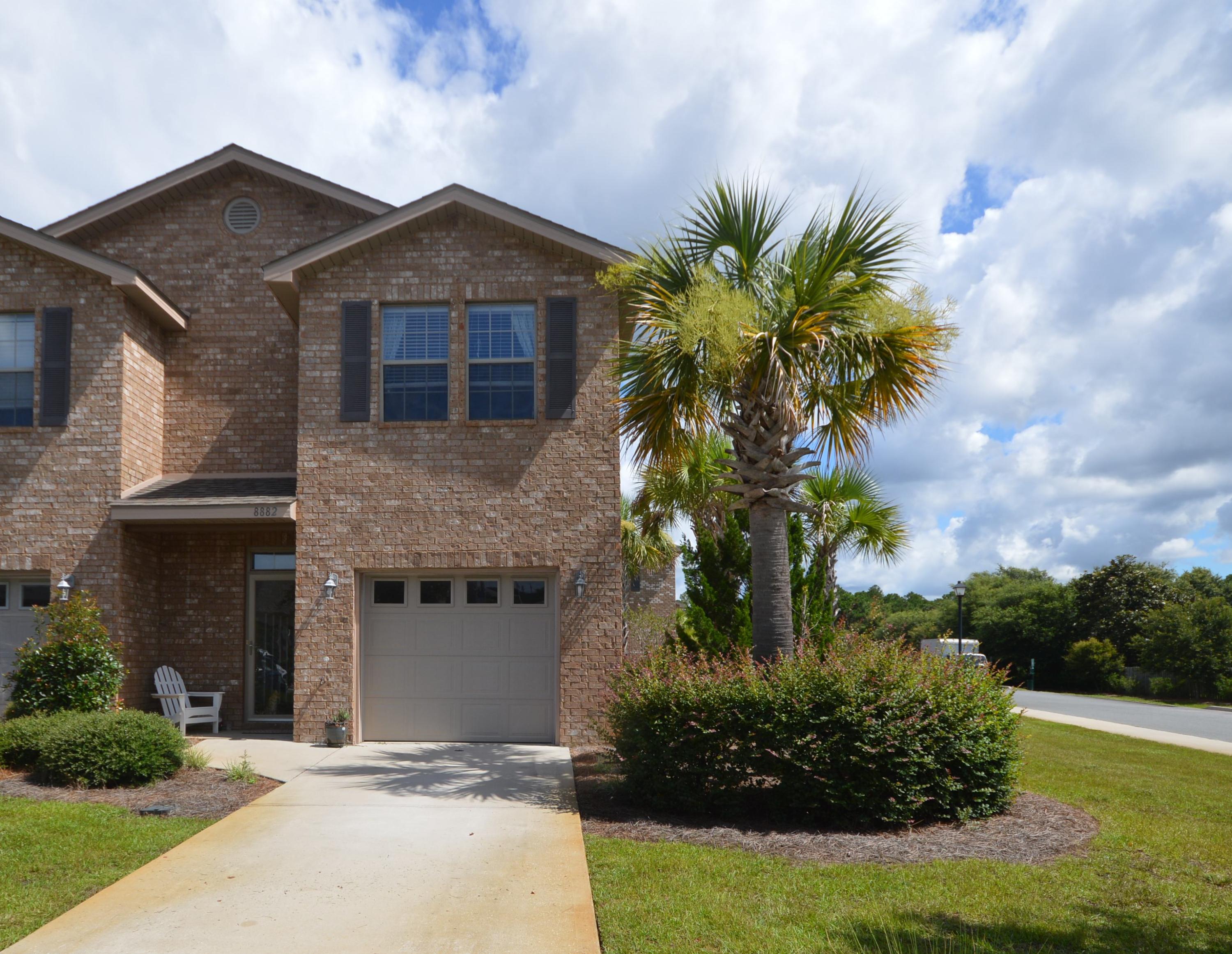 END UNIT IN PRIME LOCATION! ACROSS FROM THE POOL AND PLAYGROUND! This Unit was originally the Model Unit and has many upgrades, including wood plank floors, fenced-in backyard for pets and privacy, and stainless steel appliances. This gorgeous 3 bedroom, 2.5 bath Unit with single car garage is better than new and move-in ready. Tile flooring in all wet areas, and beautiful recessed panel maple cabinets overlook the dining and family room. Additional features include: 5 -1/4 Base Molding, security system, storm protection, Storm door, and laundry room upstairs near Master Bedroom. This property located just minutes from some of the World's most Beautiful Beaches! Cost of HOA covers most of your insurance​. ​ Don't miss out on this​ end unit. Call to schedule a showing.