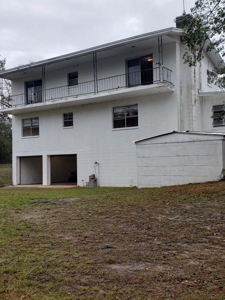 New Ac at Full price!   Lot of house for the money 2600 SF 4/2/2C Garage on Beautiful 13.4 acre parcel located on Boy Scout Road.  Property has an active Spring in back and interior has beautiful hardwood flooring. Must see this great opportunity before it's gone. Come and see what country living is like in Defuniak Springs. Located just outside of Town and just 30 minutes to the beautiful Emerald Coast Beaches. Home is dated and need of some TLC.