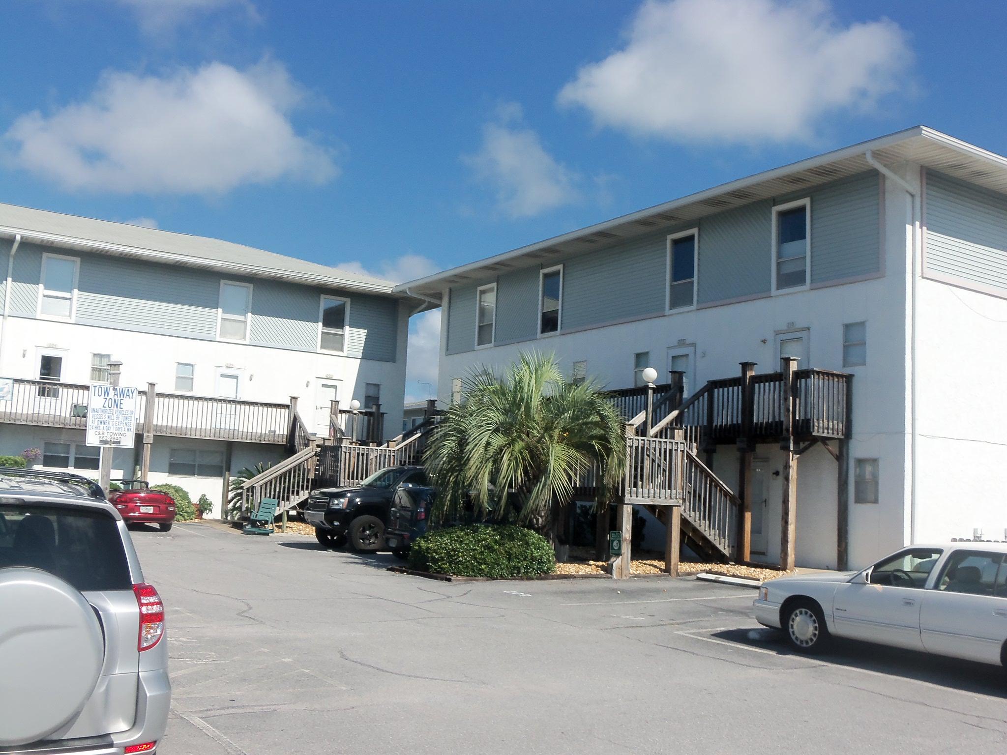 WALKING DISTANCE TO THE SPECTACULAR GULF OF MEXICO! Come home to your piece of paradise to enjoy this adorable first floor, end unit condo with all tile floors, split bedroom plan, refinished kitchen counter, new wood deck, fenced back yard. Cat or small dog under 25lbs only allowed. AVAILABLE NOW!