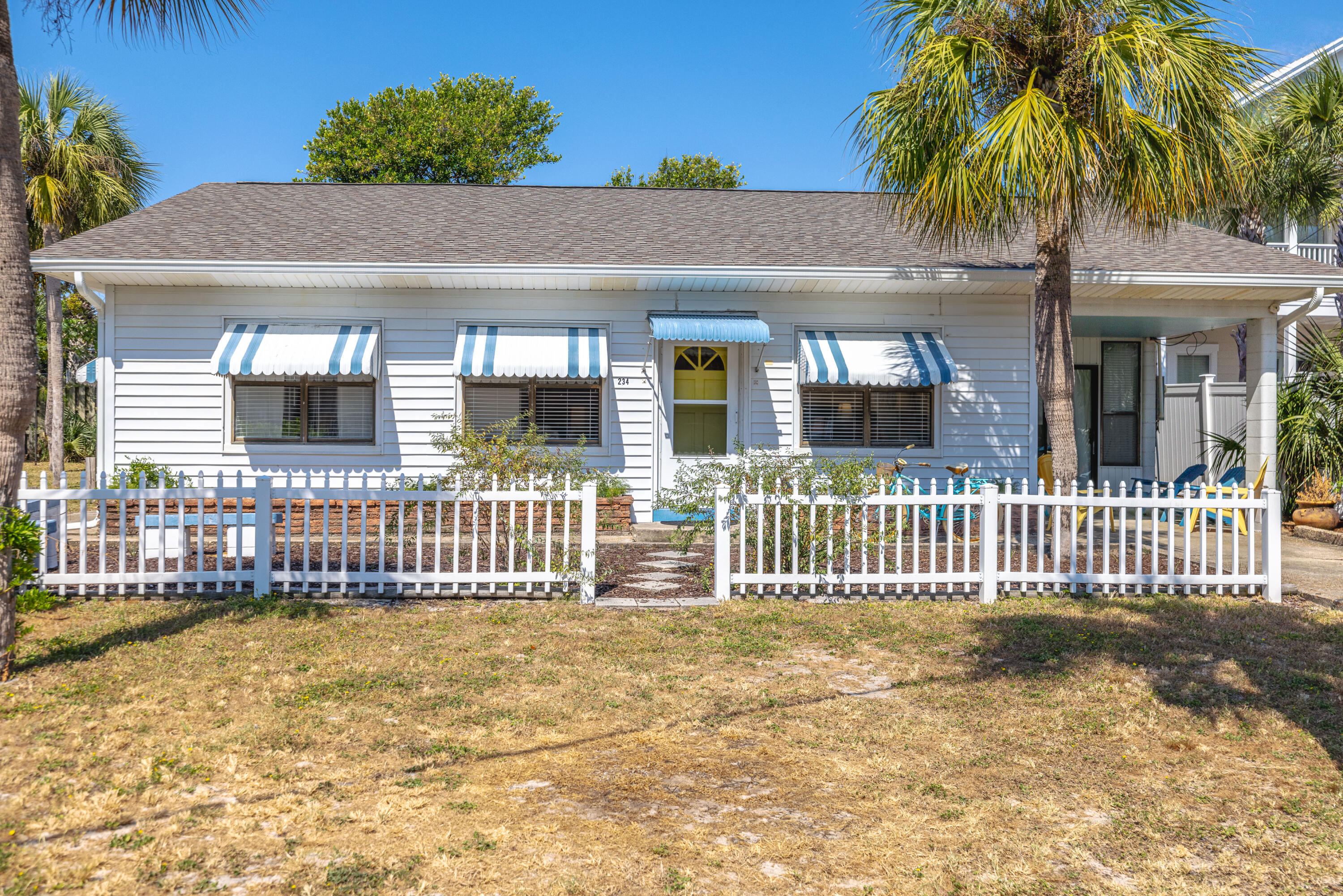 Introducing 234 Sands Street - a multi-family property on the desirable west end of Front Beach Road, just steps from public beach access. This charming beach cottage includes an attached mother in-law apartment and a separate detached cottage. Zoned R-3 and situated on an oversized 0.27-acre lot, it allows for duplex or triplex use. The main home features tongue & groove ceilings, wood floors, two bedrooms, a bunk area, and a spacious Florida room. Both additional units have private entrances, full kitchens, and bedrooms, perfect for long term or short term rentals and extended family stays. With a little TLC, this unique property offers excellent potential for three short-term rentals—an outstanding investment opportunity minutes from Pier Park and 30A!