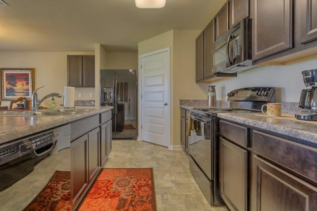 The Cali is a one story floor plan featuring 4 bedrooms, 2 baths, covered back porch & 2 car garage. The open kitchen features an island, stainless appliances and granite countertop. The kitchen opens to the great room w/ access to the covered porch. The master suite is just off the back side of the house & master bath features a separate shower, walk in closet, dual sinks & large soaking tub. Pictures, photographs, colors, features, and sizes are for illustration purposes only & will vary from the homes as built. Home & community information including pricing, included features, terms, availability and amenities are subject to change and prior sale at any time without notice or obligation. Estimated completion is December