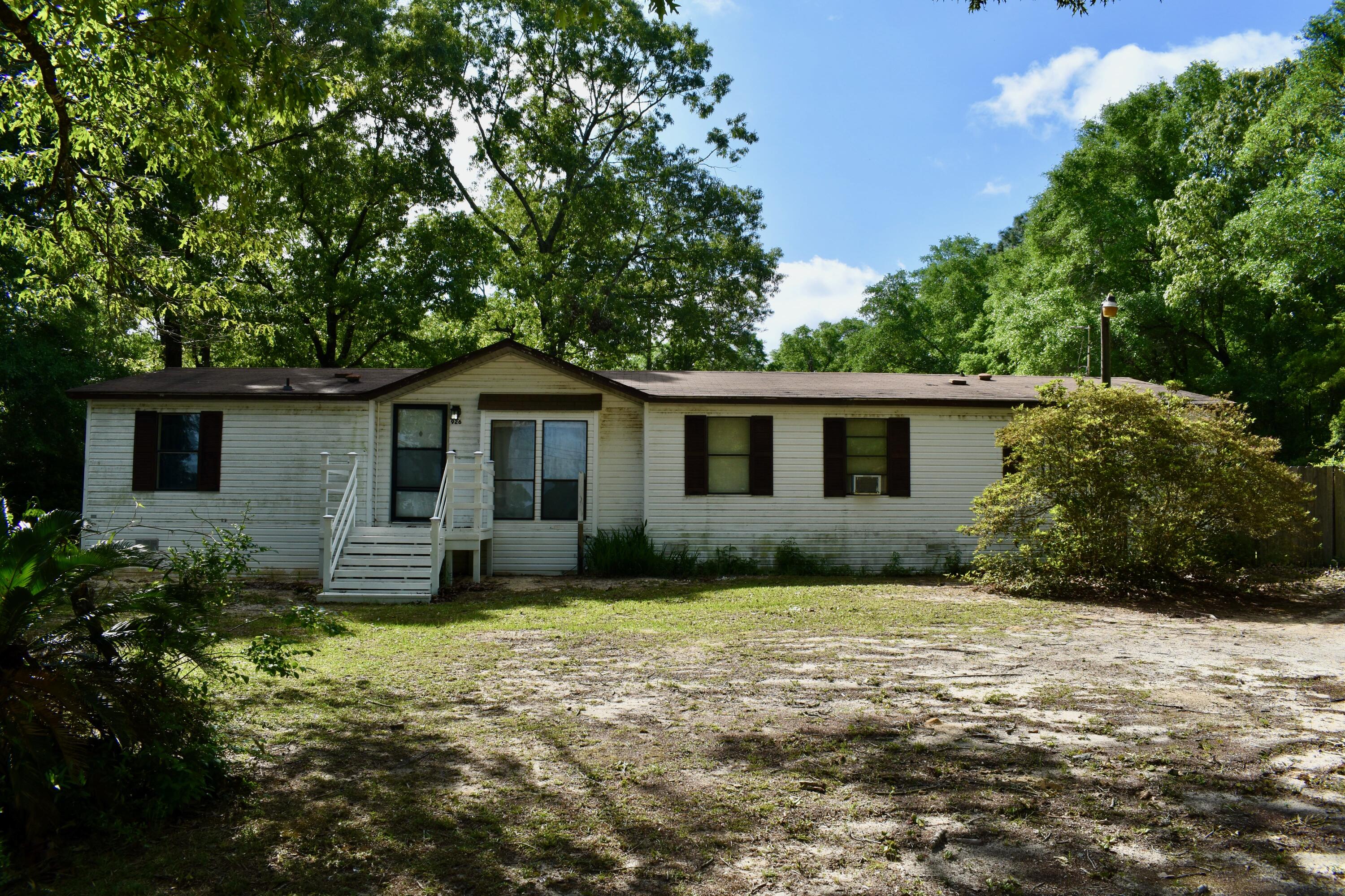 Escape to your own private oasis on 2.75 acres! This charming home comes with an extra lot, offering endless possibilities.

Outside, enjoy a private backyard with a pool and two sheds with electricity and A/C. 

Located in a peaceful area, this property offers tranquility and convenience.

Don't miss this opportunity! Schedule a showing today and make this dream home yours!