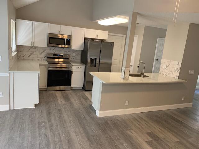 Open floor plan, tastefully renovated, craftsman style home.  This spacious home offers light pleasing colors sure to please your buyer. With new Quartz counter tops, undermount sink and all new matching Samsung appliances you can't go wrong.  Vinyl plank flooring compliments the finishes throughout the entire home. The bathrooms have a tiled shower in the master and a tiled tub surrounding in the second bath.  There is approximately 500 sf of heated and cooled loft storage space that is not included in the square footage above the living area and foyer area. Access is by way of pull down attic stairs. There is also a storage room along the back wall of the carport. There is also a good sized bonus room just off the master that can be used for an office, playroom or crafts.  Take a look.