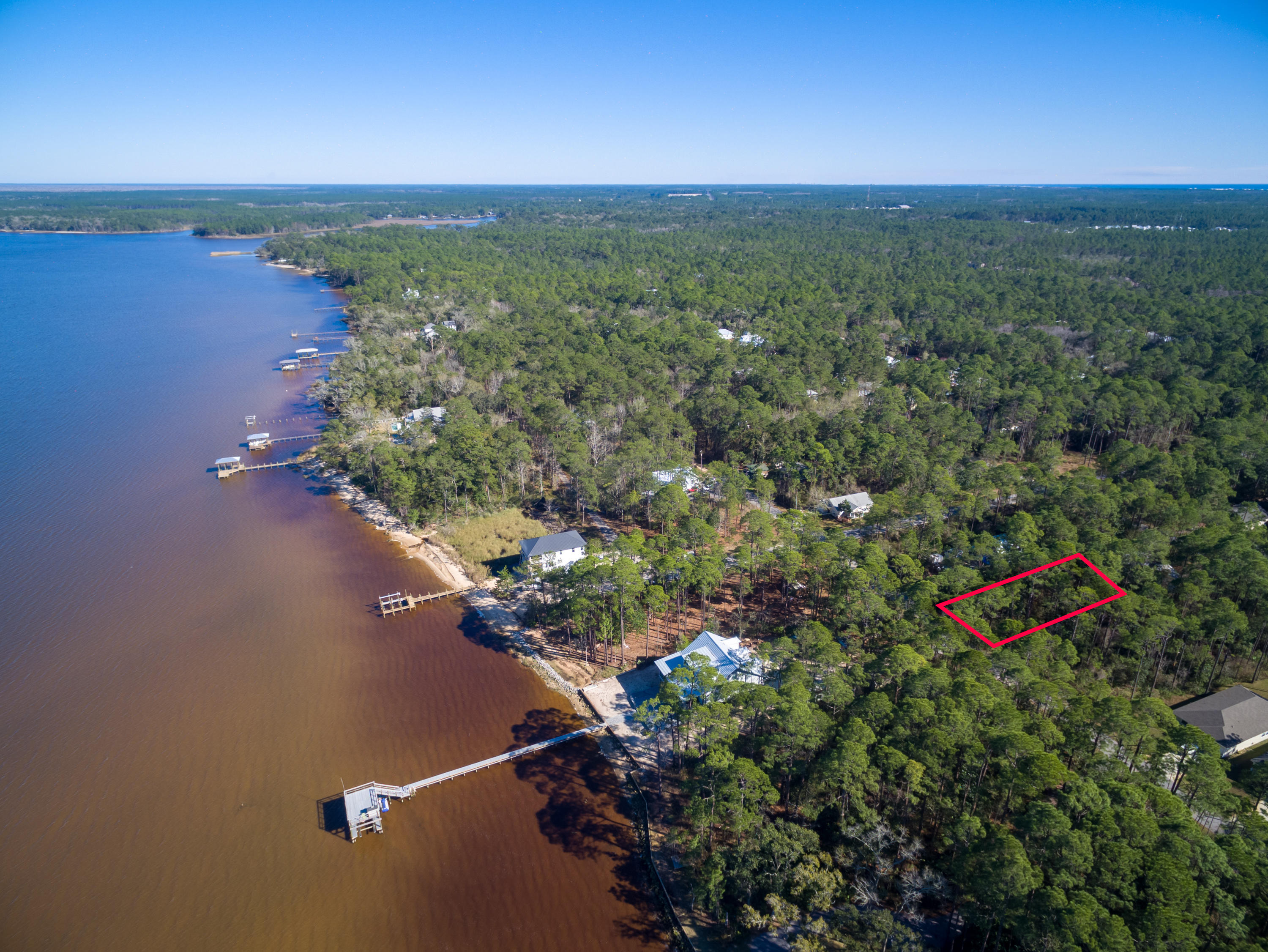 50 x 150 homesite in Point Washington located one lot off the Bay with no HOA! Possible Choctawhatchee Bay views from a second floor, and paved roads in the Magnolia Beach community. This lot is wooded and perfect for building a home with a little privacy, yet less than 10 minutes from Grayton Beach, Seaside, Watercolor, and the rest of 30A.
Community features include a boat launch.