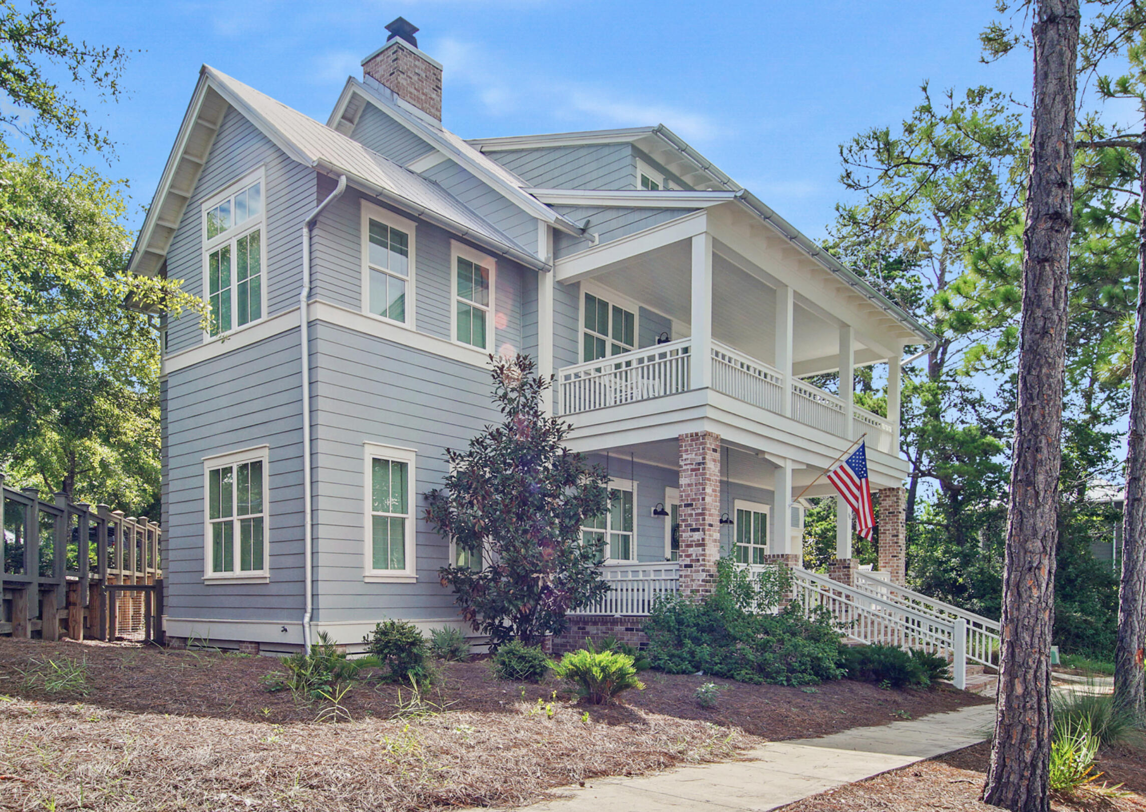 Introducing a custom built, beautifully furnished home in the desirable Forest Lakes gated community on 30A. A 3-story, 5 bed 5.5 bath coastal home sits on a corner lot with a covered parking area, and additional parking on the side street. The elegant brick stairs lead onto a large front porch with double doors opening into an open concept living room featuring a fireplace and a chef's kitchen built for entertainment. The 5th bed/bath is located on the 3rd floor and could be transformed into a game room, office, etc. There is plenty of storage with a climate controlled attic and outdoor storage unit. A screened in back porch and a fenced outdoor area with a gas fire pit is perfect for gathering. Enjoy the walking paths, 2 tiered pool, pavilion, playground, green space and beautiful lake! This custom build boasts tons of upgrades such as shiplap walls, hardwood floors, spacious closets, fixtures and beautiful tile throughout. Must see in person to really appreciate the details.
