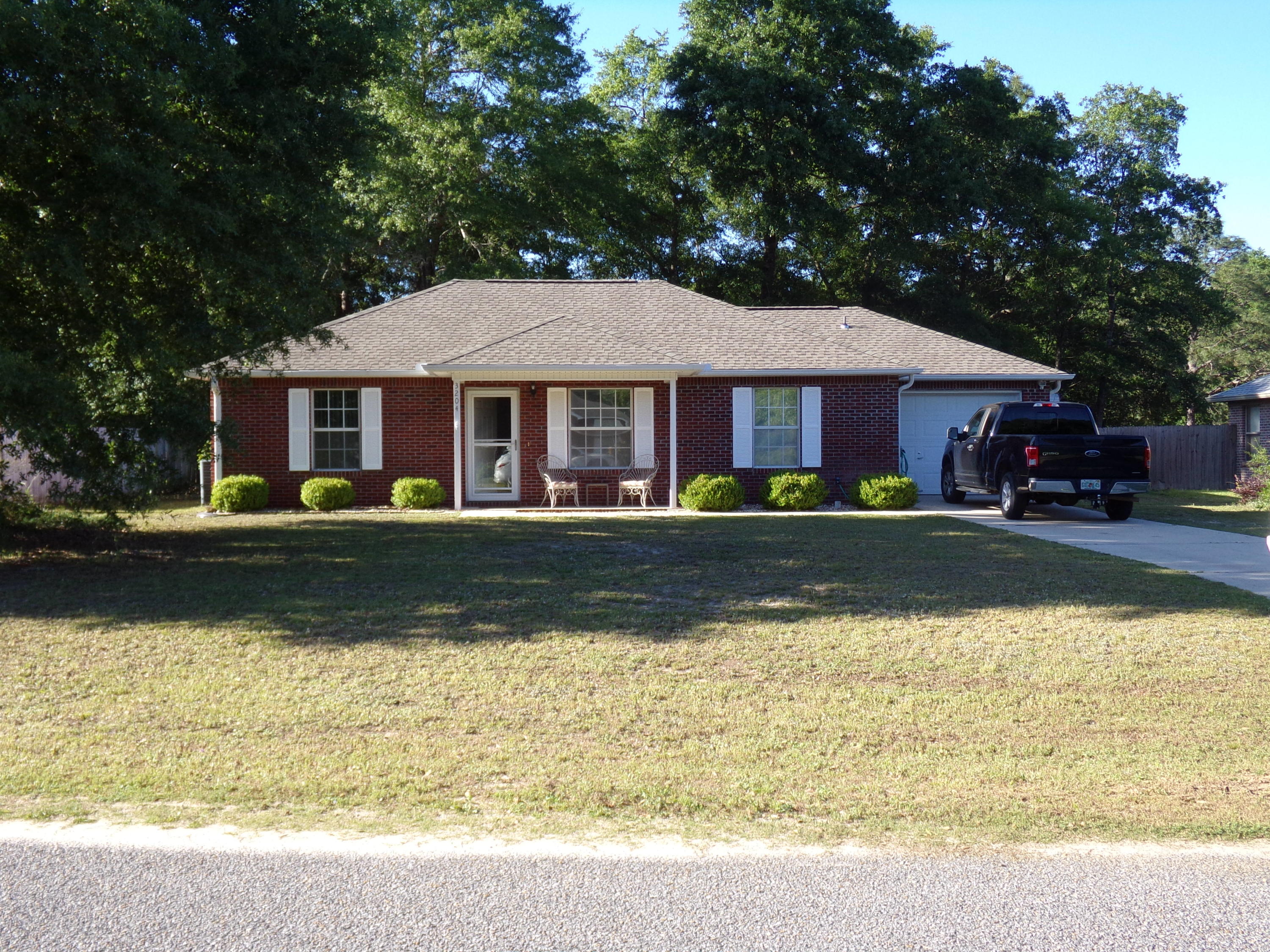 All brick 3 bedroom, 2 bath, screened in back porch, fenced back yard~  This home is just  minutes from shopping and schools~  Split floor plan~  Under ground utilities~  New roof 2021~  Termite Bond,  HVAC serviced and fresh recharge February 2021~ Yard buildings~