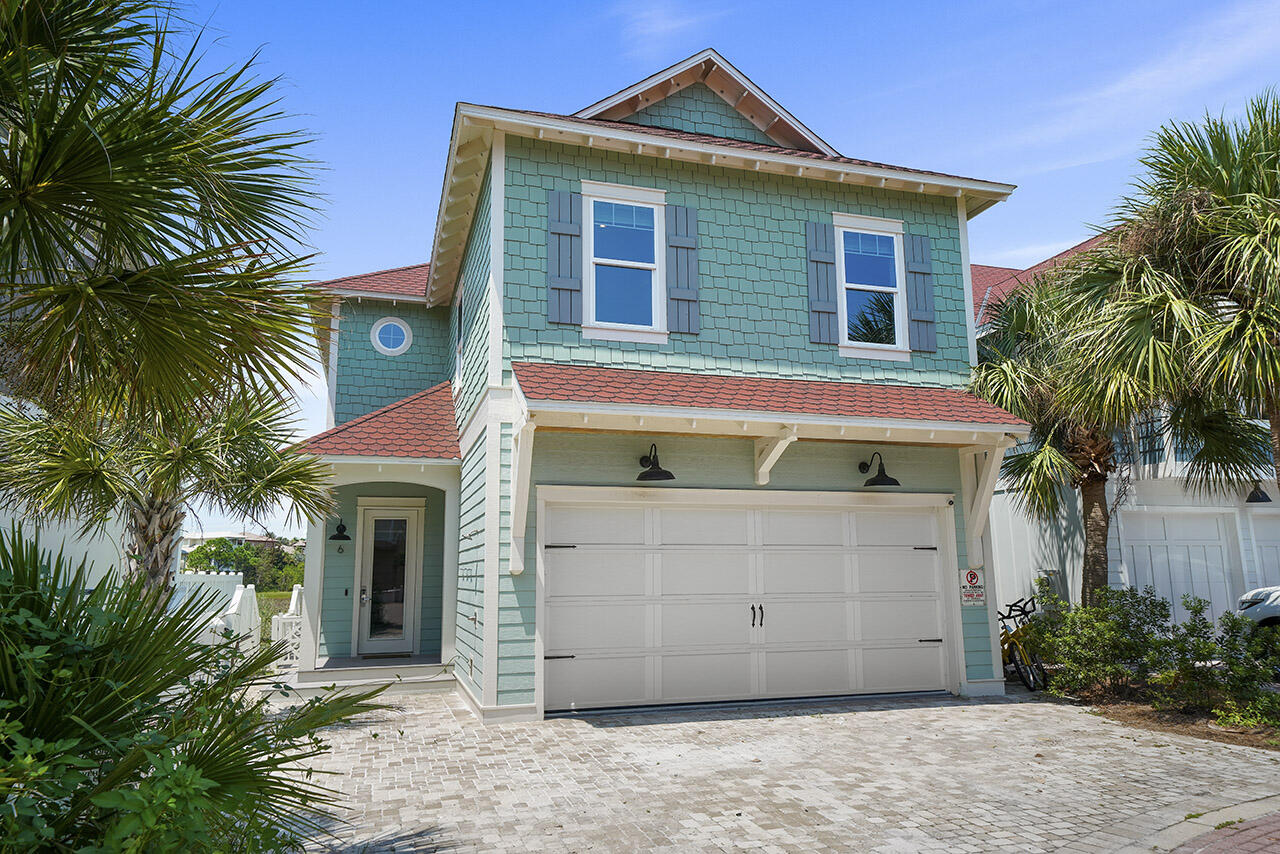 Located in the gated community of Shipwatch in Miramar Beach, this beautiful six-bedroom home easily sleeps up to twenty guests, and is just steps away from Shipwatch's deeded beach access.  Enjoy phenomenal views of one of South Walton's rare coastal dune lakes from your private pool, and pool deck which includes an al-fresco dining area with a picnic table, grill, and plenty of outdoor seating on the large outdoor sectional.  The first floor of the home you'll be greeted by a spacious open floor plan that features a living area, kitchen, and dining room.  The large gourmet kitchen is located right off of the living area, includes marble countertops, a stylish tile backsplash, stainless steel appliances, and a breakfast bar seating four. Additionally, there's a formal dining area complete with a farmhouse dining table seating ten that overlooks the pool and lake. The first floor also hosts a half bathroom and the first guest suite, with a full ensuite bathroom. 


On the second floor, you'll find 5 bedrooms along with a media den with a wet bar and a full hallway bathroom.  Right off of the media den you'll find the bunk room which features two custom-built twin/twin bunk beds.  Next, the third and fourth bedrooms are joined together by a Jack-and-Jill bathroom that features a combination shower/bath and a dual-sink vanity.  Down the hall, you'll find a fifth bedroom that includes two sets of custom-built full/full bunk beds.  There's also a hallway bathroom that features marble floors and a walk-in shower with subway tile.  Lastly, the master suite which features a private balcony overlooking the lake, and a luxurious master bathroom that includes a stand-alone bathtub, walk-in shower, and dual-sink vanity.