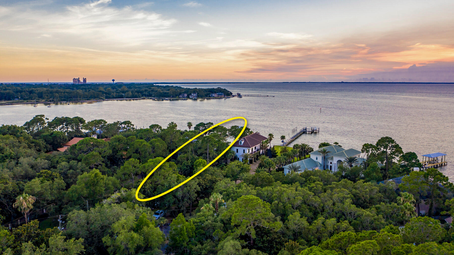 Stunning Estate-Sized Property located on the Private, Exclusive Street known as Bambi Drive of Cobb's Point, oriented on 165' of deep-water water at the point of Joe's Bayou and the scenic Choctawhatchee Bay of Destin, Florida. This Caribbean-inspired home showcases a fabulous and expansive water view corridor from its primary living area, including the kitchen and dining room. The sunsets are breathtaking!  This home features solid wood floors, granite kitchen countertops, wet bar, wine cooler, and an ice maker in the living room.  The master bath contains a Jacuzzi tub, walk-in shower, and Caldera Spa.  The Sonos surround system provides indoor and outdoor listening capability.  The pricing of this opportunity is of profound value for simply the lot if it were vacant, thus a.... knockdown and redevelopment could be justified should you be interested in customizing a new home.  Nonetheless, the current home can be enjoyed as it stands, and would make a perfect getaway from the hustle of metropolitan life, especially considering convenient access to Destin Executive Airport (DTS), only 10 minutes from the driveway of this gorgeous, irreplaceable estate.  Please inquire for further information and to schedule a private showing.