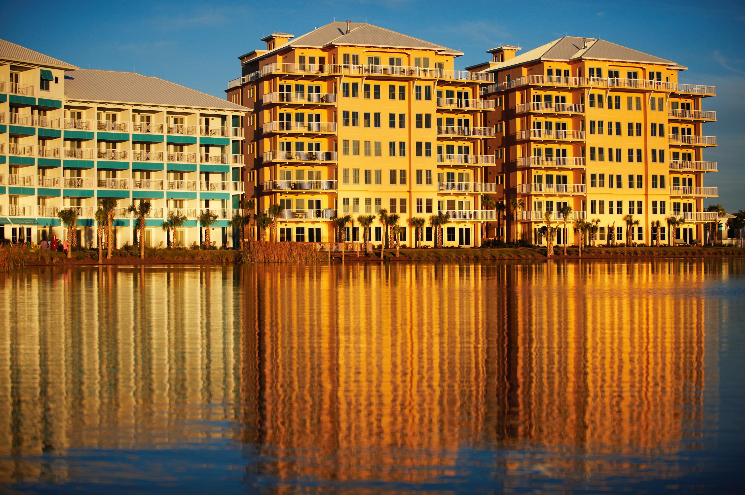 The Sunrise and Sunset luxury condominiums look over the shores of Lake Carillon and the Gulf of Mexico. This spacious 2nd floor unit has upgraded finishes and innovative floor plan and is the perfect answer to your quest for a private vacation space. These condos are only minutes from the new airport, Frank Brown Aquatic Center and fabulous shopping and dining at Pier Park. The covered porches afford maximum relaxation and entertaining possibilities. As an integral part of the community of Carillon, the condos have access to all amenities including almost a mile of dazzling white beaches, four pools, tennis courts and playgrounds.
