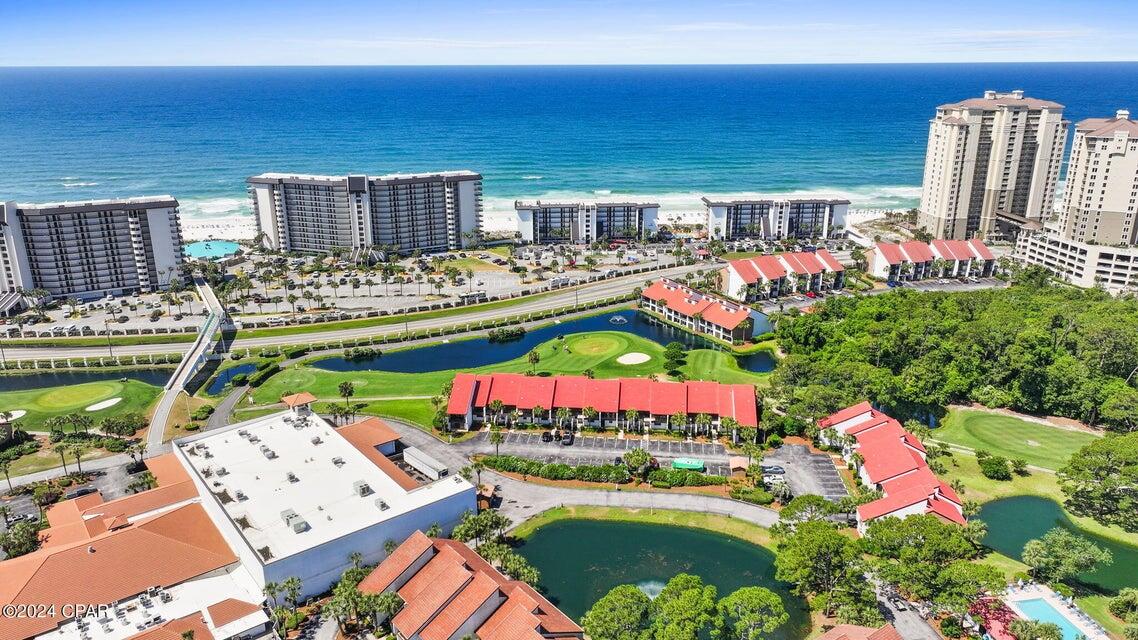 CURRENTLY UNDER CONTRACT but Seller will consider backups.  Discover unparalleled luxury living at a price that is still very affordable. Located in the middle of Panama City Beach with just steps to your private Golf Course & Beach, A private Oasis awaits. This fully furnished golf villa is located in beautiful Edgewater Beach Resort. This 2 bedroom, 2 bath located on the 2nd level has been updated with new flooring (except baths), appliances, countertops, AC , interior paint and more. Large master suite with king size bed and private bath. The junior suite is spacious enough for 2 queens and bunks or king with bunks - and also a sofa sleeper in the LR. which sleeps 8 comfortably. Among the Eleven pools, An Aquatic Center features two expansive pools, Heated Whirlpool & Wading Pool . An Aquatic Center features two expansive pools, Heated Whirlpool & Wading Pool. Great Fitness Center as well as a Shuffle Board Court, Basketball Court, Tennis Court, Pickle Ball Court & Children's Playground, there is something for everyone.
