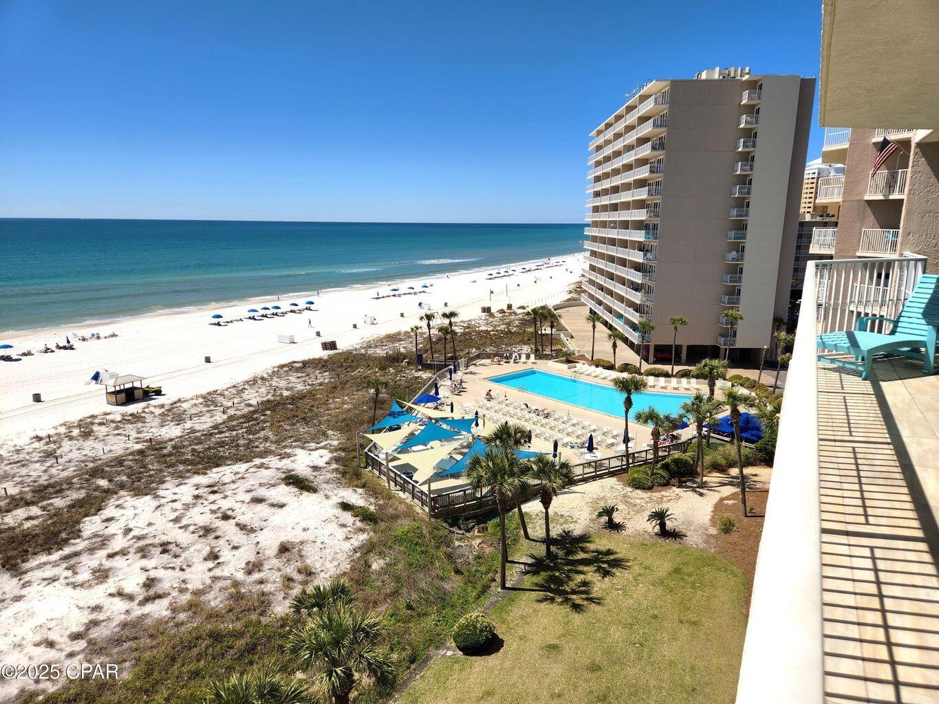 Dunes of Panama 3 bedroom condos are exceptional investment properties. 3 bedroom condos in the E building produce $75,000 - $80,000 gross annual income.   
Never miss a sunset from this exceptional 3-bedroom, 2-bath end-unit condo, where balcony access from every room creates a seamless connection to coastal breezes and breathtaking Gulf views. Thoughtfully updated, this residence features tile flooring, granite countertops, crown molding, king-sized bedrooms, walk-in closets, and full-size laundry, offering both comfort and refined coastal style. A garage parking space adds rare convenience and value. Dunes of Panama is a truly one-of-a-kind beachfront community, celebrated for its expansive green spaces, resort-style atmosphere, and prime location adjacent to Rick Seltzer Park.
Residents enjoy an impressive suite of amenities including three pools, pickleball, tennis, shuffleboard, fitness center, and on-site snack shop. 
Perfect as a primary residence, second home, or high-performing rental investment, this stunning condo delivers the ultimate beachfront lifestyle. A must-see opportunity with so much to offer. Buyer to verify all information deemed important. This comes with 1 garage space.