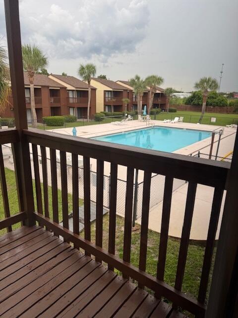 ~Price lowered!Experience low maintenance coastal living with this beautifully remodeled and fully furnished 2-bedroom, 2-bath townhome in Beachwalk Condos, ideally located on the west end of Panama City Beach. Recent updates include luxury vinyl plank flooring, updated appliances, and renovated bathrooms, giving the home a fresh, modern feel. Step outside to your covered patio, just moments from the community pool, perfect for relaxing after a day at the beach. This unit is rental-ready with short-term rentals allowed, making it a perfect investment property, second home, or vacation retreat. One of the best features of Beachwalk is its convenient access from Highway 98, so you can avoid bumper-to-bumper traffic when coming and going. Plus, you're just a short stroll to Beach Access