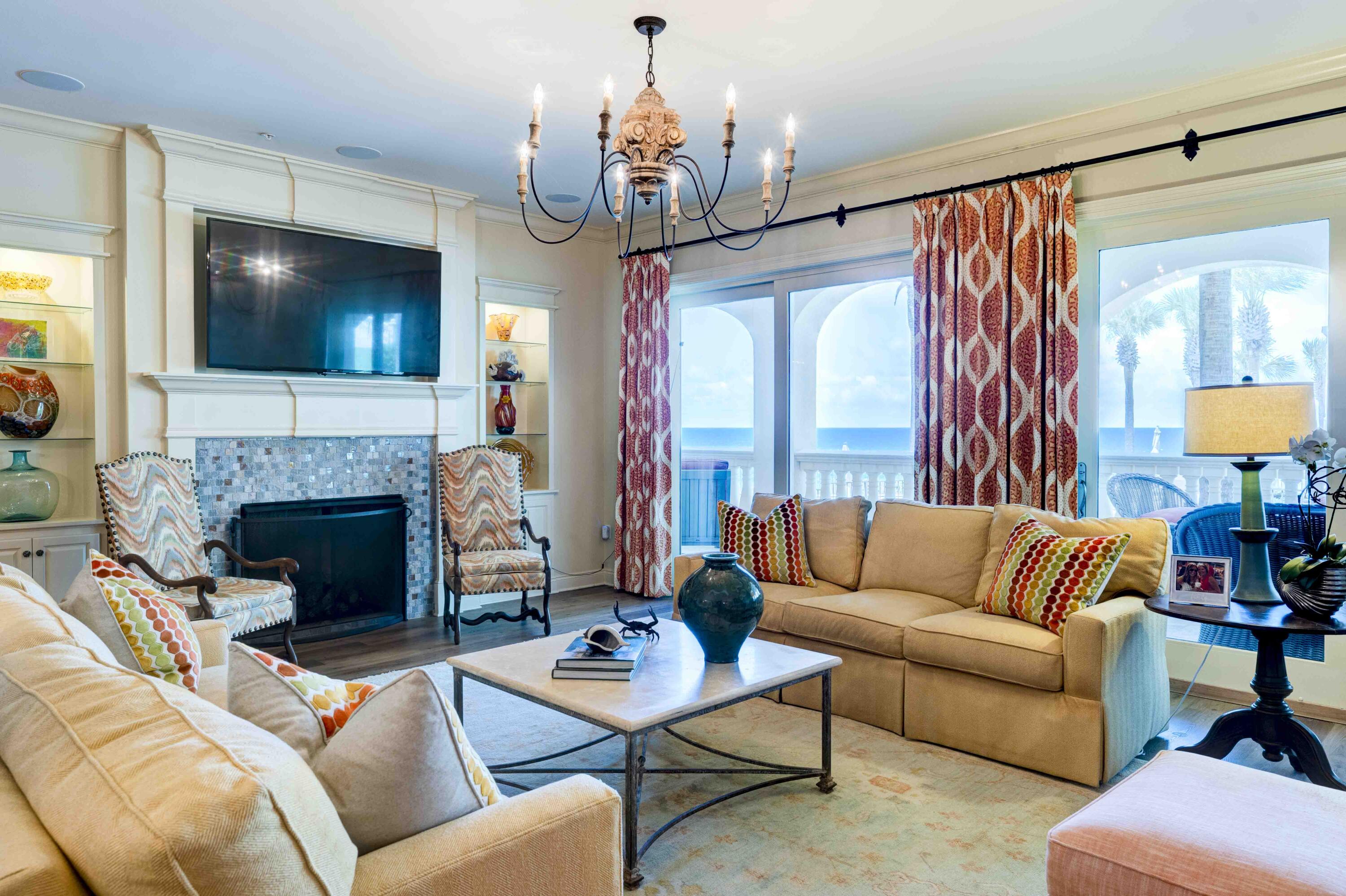 Welcome to C101, step into the largest three bedroom three and one half bath condominium home, in Bella Vita on Blue Mountain Beach boasting over 2735 square feet with 530 square feet of veranda with breathtaking views rising above the gulf, sparkling pools and stunning piazza.  Rarely does a condominium home in Building C with only 9 residences become available.  Beautiful azure blue Gulf waters unfold before your eyes drawing you out to the terrace which spans the breadth of the residence.  This immaculate corner condominium home with fireplace and premier media is a highly coveted first floor walk out and features over $500K in furnishings and upgrades including impact glass doors and windows, and front door installed in 2024, as well as two HVAC systems installed in 2024. C101 enjoys a separate storage unit right outside the front door for stowing away extra beach items and there is storage under the building. The C building is contiguous to the beach walk over, pools, steps away from the Sunset Deck for grilling, and adjoins one of the designated spaces for pets.  The Primary Bedroom lets on the veranda and features two walk in closets and the Primary Bath is graciously sized with dual vanities, soaking tub, separate shower and water closet and linen closet.  The quality interior delineations throughout include solid surface flooring, custom gas fireplace, kitchen designed by Linn's Prestige Kitchen with custom cabinetry including a high-end appliances.  The resident chef will enjoy the Dacor 6 burner gas cook top, double ovens, Bosch dishwasher, Kitchen Aid ice maker, and Sub Zero Refrigerator.  The private En-suite Guest Bedrooms are very large and comfortably accommodate guests.  There is a separate laundry room with built in cabinetry and a separate Powder Room. 
Gated Bella Vita in Blue Mountain Beach comprises a total of 48 residences with 365 feet of beach on approximately 6 acres, a Great Hall with conversational seating, a Library, porte cochere and an excellent Fitness Center to encourage work out enthusiasts to stay fit while at the beach. Convenient to Bella Vita on Blue Mountain Road is the 30A bike path, coastal towns, bike shop, restaurants, health food store, donut and ice cream shop and shopping. We invite you to discover Bella Vita 30A's best kept secret where pride of ownership is reflected in attention to detail in the quality maintenance of the buildings, the landscaped grounds, parking, and amenities.  Plug in and start playing and enjoy carefree life at the beach in C101!  Bella Vita....is the Beautiful Life