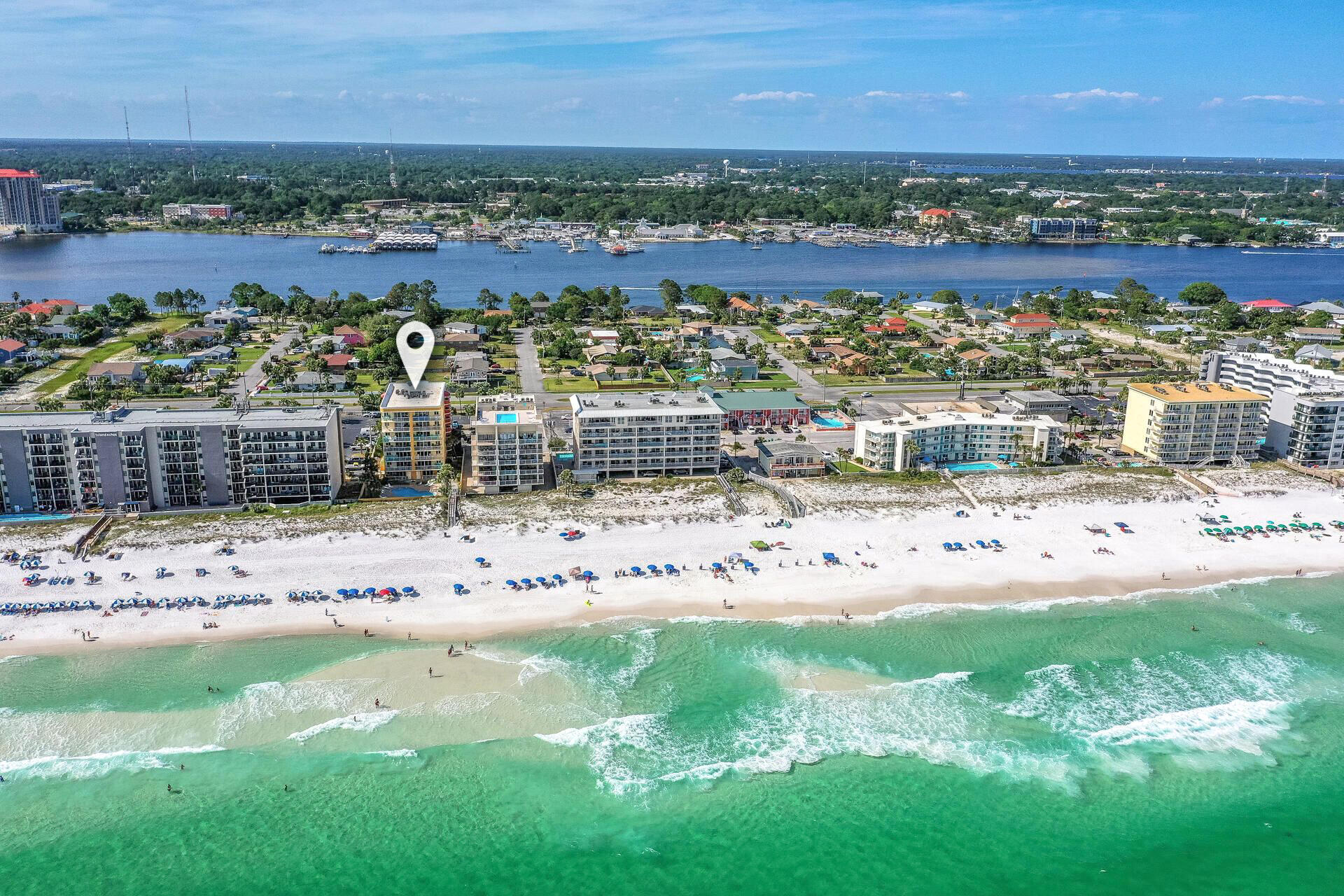 This penthouse unit at Dune Pointe on Okaloosa Island is just beautiful! Fully furnished and designed with coastal chic décor and finishings, this unit provides owners and guests a serene place to enjoy the beach life. Enjoy gorgeous Gulf views from the spacious balcony or through the large glass sliders from the living room. The open living, dining, and kitchen area provide a perfect place for family to gather. The owner's suite is spacious and includes a stunning bath with wood plank ceiling, gorgeous tiled shower with glass walls and a waterfall showerhead. The guest room and full guest bath are in the north end of the unit. Other touches throughout the unit include wood plank tile flooring, beautiful granite countertops, and stainless steel appliances. This is a perfect paradise! Dune Pointe is a mid-rise condominium with only 20 units. A gulf-front pool and direct beach access ensure that you have relaxation at your fingertips. Located on Okaloosa Island, you're minutes from shopping, entertainment, and restaurants, and just a quick drive from all the fun in Destin. This is a great location for a second home or investment property!