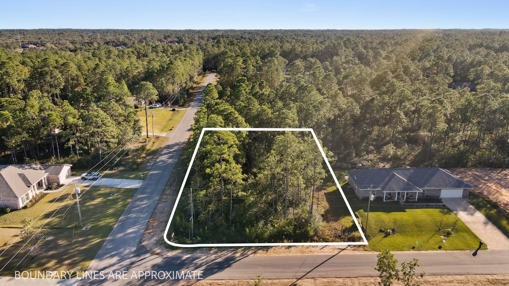 Come build your new home on this beautiful oversized corner lot in Holley By The Sea with 0.50 acres of buildable uplands! (Wetlands study available) Ownership includes membership to Holley by the Sea's multi-million dollar 45 acre recreational center with 3 swimming pools, 8 clay tennis courts, fitness center, basketball courts, sauna and steam room, playground, game room, and community clubhouse located on the Santa Rosa Sound with playground, dock, access to the East Bay boat launch and more! Enjoy being only minutes to the gorgeous white sandy Navarre beaches and emerald green water.