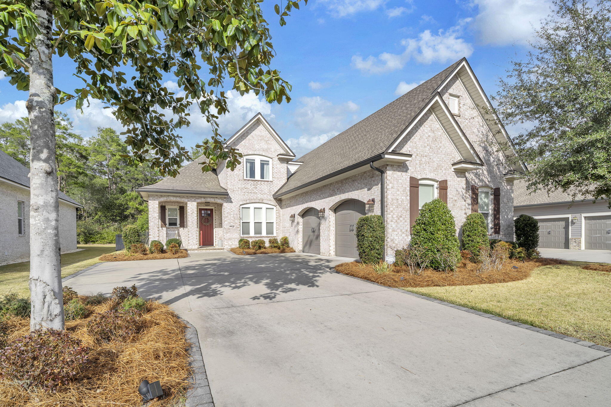 Gorgeous home in the sought-after waterfront community of Waters Edge on Niceville's Rocky Bayou. This intimate neighborhood offers private access to the bayou, a community dock, and kayak storage — perfect for enjoying the coastal lifestyle.
Built by renowned Randy Wise Builders, this beautifully crafted home showcases their signature quality and attention to detail. Throughout the home, you'll find craftsman-style cased openings, crown molding, picture-frame windows, and neutral paint colors .The spacious layout includes five bedrooms plus a dedicated office. The main floor features an open-concept design ideal for entertaining, with a large living room with a brick feature wall and dining area flowing seamlessly into the chef's kitchen. The kitchen boasts an abundance of shaker- style cabinetry, quartz countertops, a large island, built-in desk area, and stainless appliances including a drop-in gas cooktop, built-in oven and microwave, dishwasher, and refrigerator.
Tucked privately at the rear of the home, the primary suite is a relaxing retreat with a spa-like ensuite bath featuring a barn door, freestanding soaking tub, separate walk-in shower, and double vanity. The spacious walk-in closet offers convenient access from both the bathroom and hallway.
The main living areas and bedrooms feature wood flooring, with tile in select areas. The office includes built-in bookcases, a closet, and even a custom pet crate tucked neatly under the stairs. An additional suite completes the main floor. Upstairs, you'll find three generously sized bedrooms, a shared bathroom, and walk-in attic storage.
Step outside to enjoy the screened porch overlooking the patio and fenced backyard, which backs to a wooded area for added privacy. The patio is plumbed for natural gas (perfect for grilling), and the backyard is also wired for a future hot tub.
Additional highlights include , oversized two-and-a-half-car garage with epoxy-coated floors and dual garage doors, plus the added peace of mind of a whole-house generator.
--