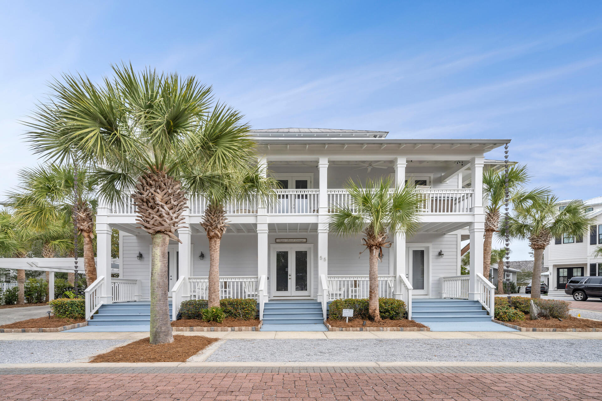 Situated on a prime CORNER location, this home is an idyllic setting for everyday living and entertaining or for a vacation rental/investment property. This home exudes Florida elegance, communicated through beautiful finishes, superb craftsmanship and decadent amenities. 4 bedrooms plus 4.5 bathrooms are spread across three floors and  THREE expansive porches that run the length of the home! Inviting, light-filled rooms welcome you, while the home's coastal chic ambiance suggests casually elegant living and entertaining in all seasons. This beautifully designed Caribbean style home has high end finishes throughout including: 10' ceilings, 8' doors, triple crown molding, a gourmet kitchen with state of the art appliances (including gas stove), custom window treatments, hardwood floors, all tile baths, outdoor shower, and much more. There are two ensuite master bedrooms and bathrooms, another large ensuite bedroom, and a bunk room with its very own bath! Each floor has its own living area for multiple entertainment areas.  Seacrest Beach is located within easy walking, biking or driving distance to Alys Beach, Rosemary Beach and all of the great restaurants and entertainment along 30A. The beach is quick to access via the seasonal tram service for hop on, hop off beach service! Enjoy the palm lined streets, guest parking, 1.3 miles of unmarked trails and South Walton's tallest sand dunes.
