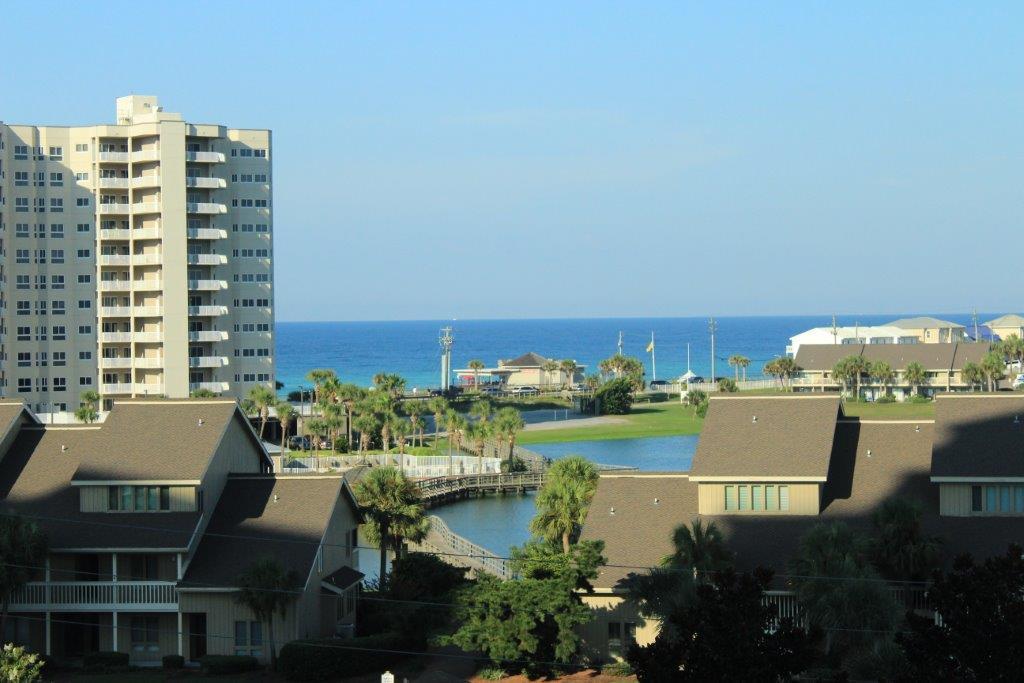 Awesome views of the Gulf Of Mexico and Stewart Lake in sought after gated Seascape Resort! Enjoy the sunsets in this South facing 2 bedrm, 2 bath, W/ bonus Bunkie rm for extra lodging. Literally 2 min walk to sugar white sands, emerald green waters & private beach access is what the Doctor ordered. Centrally located to all the conveniences within walking distance or just a few blks you have Silver Sands Outlet Mall, Shopping & Restaurants galore. Plus an 18 hole golf course right on the premises along W/ Cabana Café Restaurant, tennis cts, fitness rm, 3 swimming pools, bike rentals & conference center. Home is great for entertaining W/ open concept floor plan views of the Gulf from most of the unit. Whether you call it home or use it as an investment W/ rental projections 35k+ great value