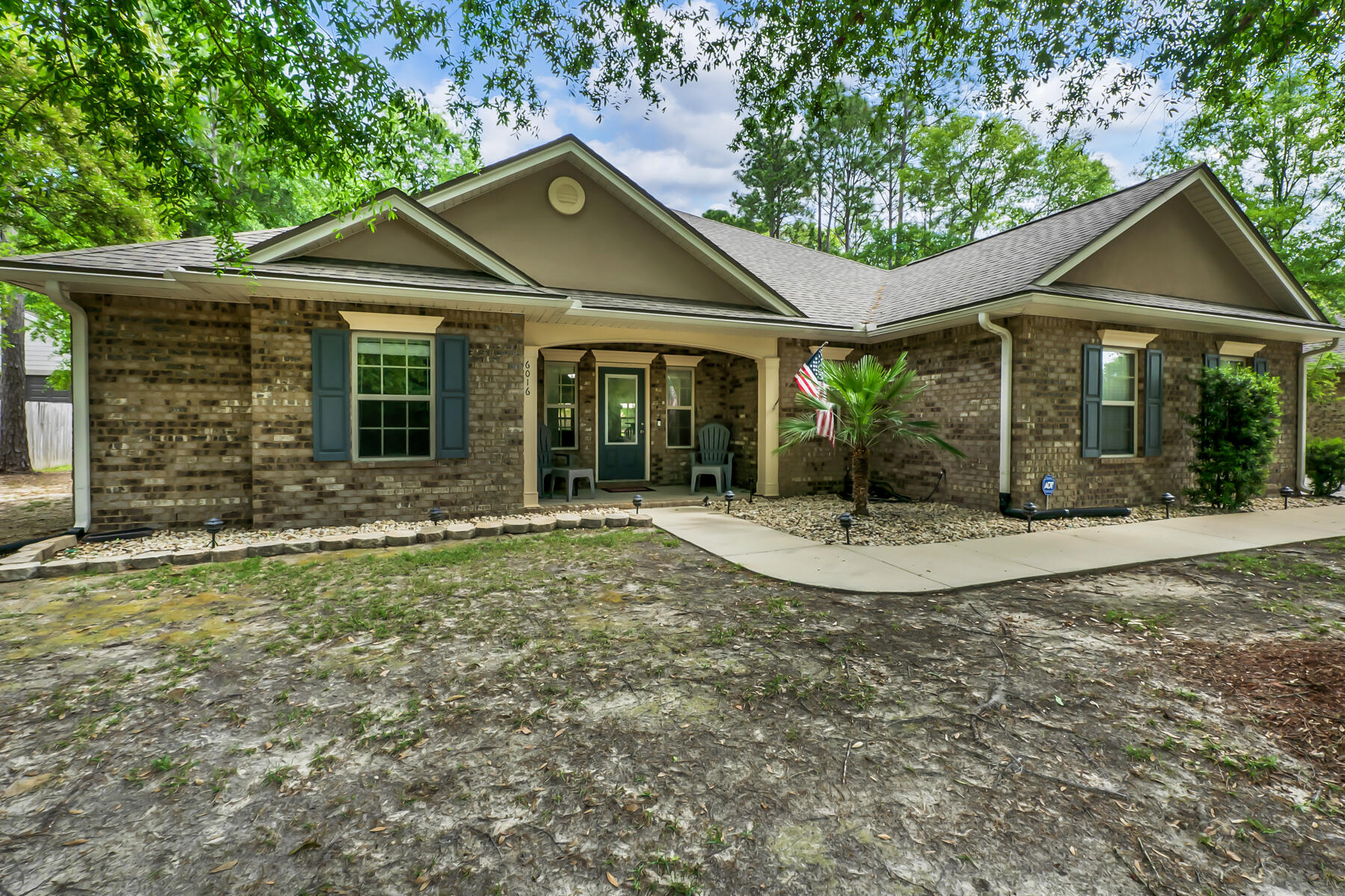 Welcome to your new home in Camellia Cove! This charming all-brick residence offers the perfect blend of comfort and space. Situated on a generous half-acre, with covered front and back porches and a large, privacy-fenced back yard, you'll have plenty of room to bring your creative visions to life -- enjoy the luxury of space and privacy in this peaceful setting.

Inside, you'll find a spacious single-story layout featuring a large open great room, perfect for gatherings and relaxation, complete with built-in bookshelves. The roomy, eat-in kitchen is a chef's delight and features granite countertops, plenty of counter space, stainless appliances (including a flat cooktop stove), and a pantry. 

The split bedrooms offer privacy and tranquility,. The primary bedroom has its own en suite with dual vanities, a garden tub, walk-in shower, and separate toilet room. Two nicely sized guest rooms share a second full bath. There is also a 1/2 bath for guests. The bonus/sunroom provides additional, versatile space for all of your needs. With thoughtful touches like a side entry garage, there's ample parking for your RV or boat (subject to HOA regulations).

Don't miss out on the opportunity to make this beautiful home yours, where comfort, space, and convenience come together seamlessly. Contact us today to schedule your tour!

-Termite bond in place. 4-point, wind mitigation report, and usable survey available from when sellers purchased. 2011 roof, 2011 water heater, 2020 AC. Average utilities -- $30 max water, $190 highest power bill since ownership. Sellers just relocating to care for elderly parents.