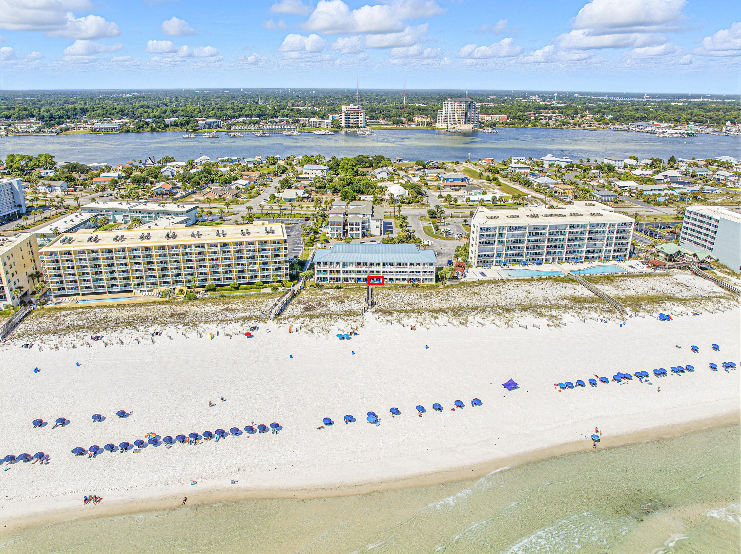 Enjoy the luxury of beachfront living in this ground-floor condo within a charming 27-unit community on Okaloosa Island. Step from your private patio straight to the sand, no stairs or elevators, just effortless access to the beach, pool, and amenities. With projected rental income of $47K annually, it's perfect as a primary home, vacation getaway, or investment. Community perks include a sparkling pool, grilling area, picnic space, assigned parking, and well-kept grounds. Conveniently close to dining, shopping, and attractions, this condo blends coastal comfort with great investment potential.