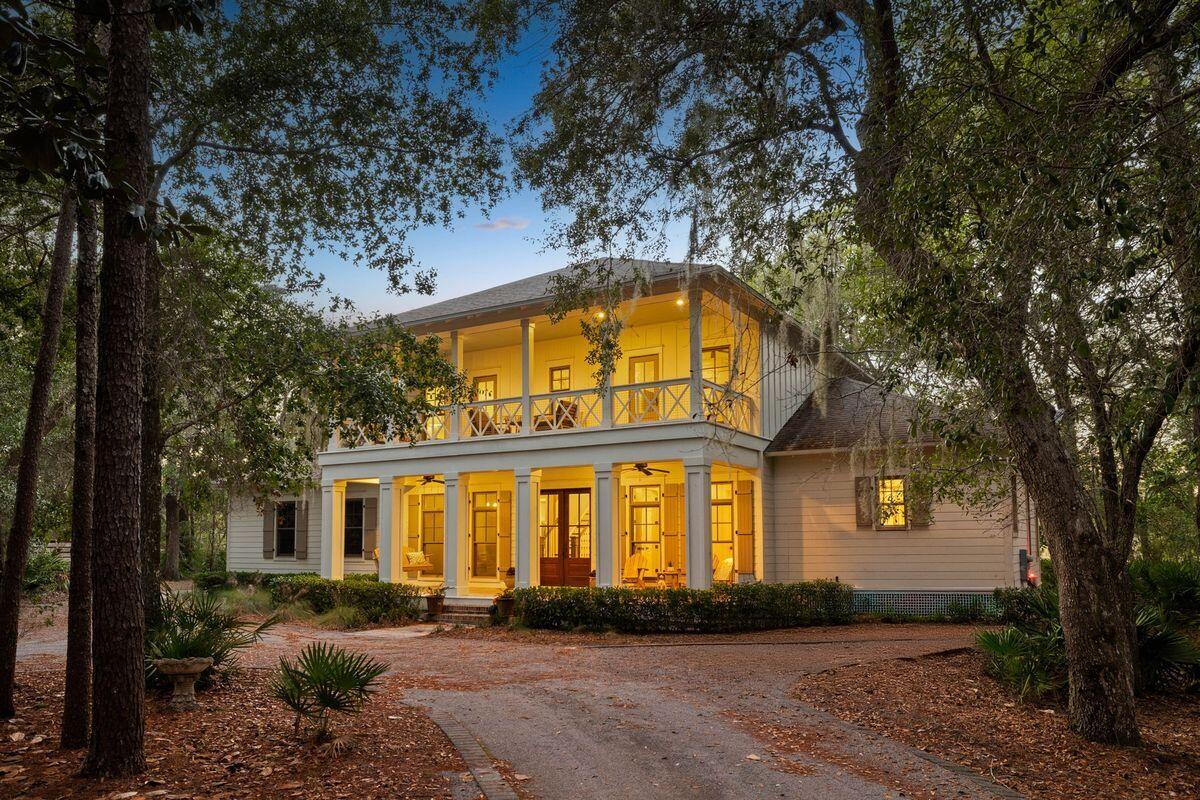 Welcome to a breathtaking bayou-front sanctuary that perfectly balances Southern sophistication and coastal luxury. Nestled on a sprawling one-acre estate with 162 feet of pristine water frontage, this remarkable home is located in The Estuary—a gated, ultra-private community often described as '30A on the Bay.' Surrounded by the serene Point Washington State Forest, this enclave offers unmatched tranquility and convenience.

Crafted in 2013 by Luke & Blue's Custom Homes, this two-story sanctuary welcomes you with a stately circular driveway surrounded by lush native foliage, creating an aura of privacy and natural beauty. The inviting front porch, adorned with a Bevelo gas lantern, cozy swing, and mahogany double doors, exudes timeless Southern charm, while the expansive rear screened porch offers a wood-burning fireplace and panoramic views of the bayou and bayideal for entertaining or quiet evenings outdoors. A private boardwalk leads from the meticulously landscaped backyard to your personal dock and boat lift, ensuring seamless access to the Choctawhatchee Bay for boating adventures.

Step inside to discover a thoughtfully designed home where warmth meets sophistication. The heart of the homea spacious kitchen and living areafeatures reclaimed heart-of-pine plank flooring, shaker cabinetry, beamed ceilings, and a large center island with custom stone countertops. 

The main floor hosts a serene primary suite with a spa-like ensuite, complete with a soaking tub, walk-in shower, dual vanities, and two walk-in closets. Additional first-floor amenities include a formal dining room, a second bedroom that could be used for an office space, and a generous laundry room adjacent to the oversized two-car garage. Upstairs, you'll find three more spacious bedrooms with adjoining baths, a second living area, a bonus room, and ample storage. Both levels boast expansive covered porches, seamlessly blending indoor and outdoor living.

Whether you're seeking a primary residence or a tranquil retreat, this exceptional property delivers the perfect balance of privacy, luxury, and adventure. With its unparalleled location, timeless design, and seamless access to coastal amenities, this home is more than just a place to liveit's a lifestyle.