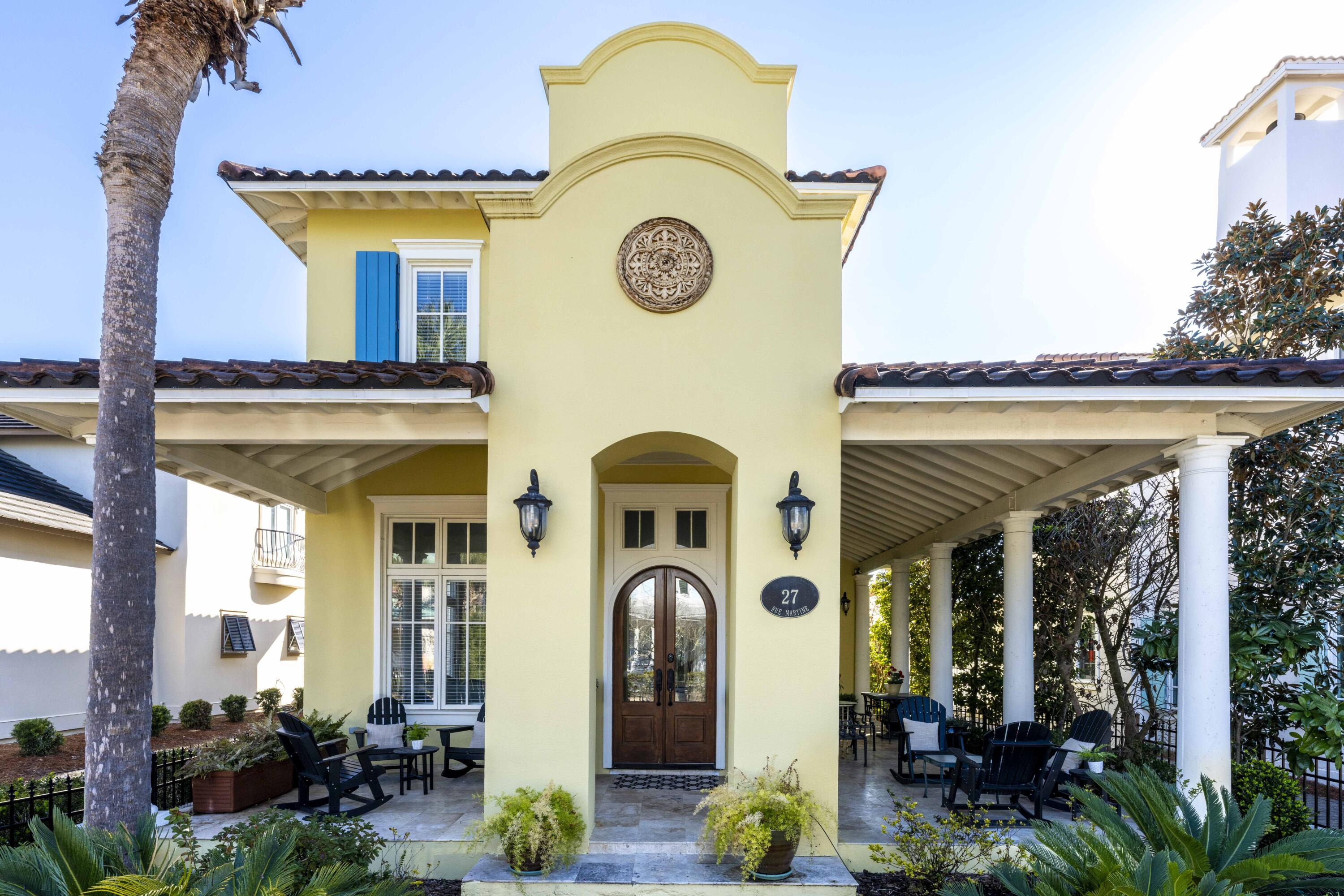 Welcome to the gated beachfront Neighborhood of Caribe where you are invited to discover 27 Rue Martine, with open floor featuring 4 bedrooms and 3.5 baths of which one bedroom and a bath are tucked away in the Guest House. A pneumatic elevator can be easily installed, see documents for quotes. As you enter the well-conceived interior space through the double mahogany doors of the living room with fireplace you are immediately drawn through the home, past the staircase with 23 foot ceiling height, beyond the formal dining room, and kitchen and dining/sitting area to the tall French doors inviting you to the courtyard. 27 Rue Martine is differentiated by the home's well-conceived floor plan for entertaining, natural light, numerous tall windows accentuated by transoms, high ceilings throughout, crown molding, French doors, large bright and airy well-appointekitchen, walk-in pantry, built in customized niches, quality hard surface flooring travertine and wood flooring, oversized laundry room, large guest bath, and thoughtfully designed interiors letting on to the wrap around porch with fireplace, guest house and the spacious courtyard. The driveway can accommodate four vehicles.  The primary bedroom features two closets, private bath with linen closet, separate glass shower which adjoins the vanity, a soaking tub and water closet.  The kitchen features ample countertop space, Viking slide in gas range with 6 burners and griddle for gourmet cooking, windows over the sink and next to the range and walk in pantry.  The kitchen marries the informal dining room which may also be furnished and enjoyed as a sitting area.   Whether you wish to entertain indoors, outdoors, formally or informally, you and your guests will enjoy gracious Caribbean Style living among the beauty of Caribe.  Caribe is a picturesque beach neighborhood tucked away on an uncrowded stretch of beach in Miramar Beach is always beautiful, never crowded as rentals are limited to a minimum of one week and a maximum of 8 person occupancy. Owners enjoy tennis/pickleball court, two gleaming swimming pools with bath houses, lake pavilion with bath house, two beach walkovers and professional beach service, beautiful beaches, sidewalks for strolling throughout the neighborhood, courtesy patrol, gated entry with soft evening lighting and beautiful streetscape. Live and play minutes from the area's finest golfing, tennis, dining and shopping. Explore nearby Silver Sands Premium Designer Outlet, Grand Boulevard, Market Shops at Sandestin and AMC Classic Boulevard 10. On Saturday mornings after a walk on the beach, head to the Farmer's Market at Grand Boulevard for fresh fruits, vegetables and local honey, or breakfast at the Market Shops at Sandestin. We invite you to make an appointment today to discover 27 Rue Martine located in picturesque Neighborhood of Caribe.