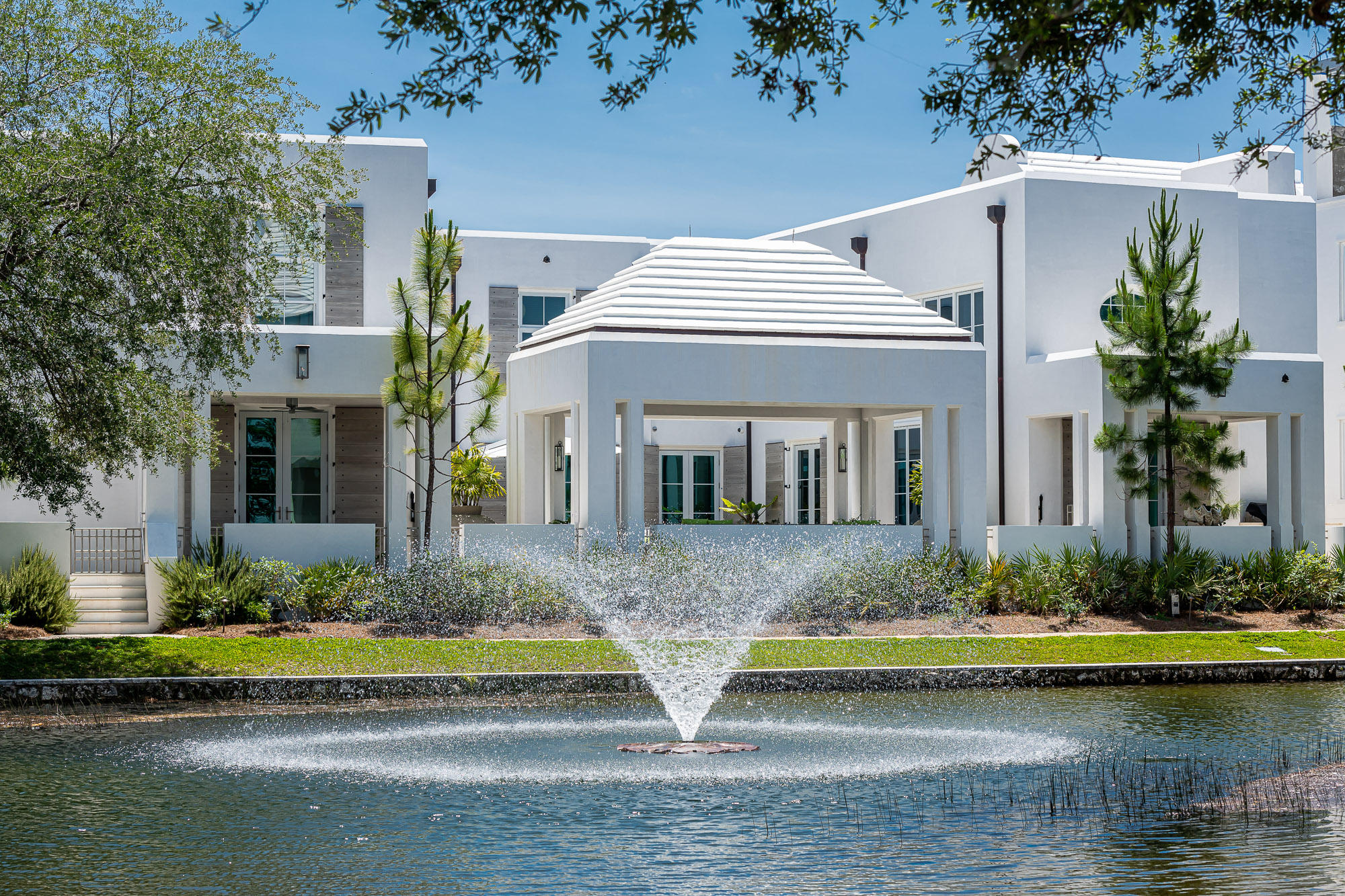 Imagery and words cannot properly speak to the beauty & character 105 Hogpenny Alley provides. Alluring spaces with exquisite craftsmanship encapsulated by the surrounding beauty of Alys Beach's Lake Marilyn center this Bobby McAlpine designed home to perfection. Overlooking the iconic Lake Marilyn of Alys Beach, with 100' of water frontage, this incredible home is only 1 of 8 custom homes designed & built within this prestigious lake front setting.
The home's 5,241 square feet of conditioned living space opens to, and surrounds, the manicured courtyard, large covered loggia, and heated pool. The Control 4 remote descends the Sunbrite TV from the ceiling of the courtyard loggia for outdoor movie nights with family & friends. The 5 bedrooms, each having their own ensuite bathrooms allow for privacy & separation from guest to guest.  Natural light floods all rooms with the strategic home design to allow for the greatest transitions of east to west light.  

Custom interiors by Ann Holden Design with Jill Bohn set forth interiors unparalleled by none other.  French limestone flooring, is carried throughout the 1st floor, subtly woven with the designer furnishings & wormy oak wall panels found in the home's gathering locations.  The kitchen, dining, and living rooms are framed with stained gray wormy oak walls that transition to the gloss walls of Venetian Plaster.  Open ceiling heights ascend to a coffered ceiling adding volume to the spaces you will spend most time in.  

The gourmet kitchen frames the character of the home set in a wormy oak surround with the waterfall edge Calcutta Gold Marble island.  Hosting is a must to utilize the professional appliances led by the 48" Miele all in one range featuring burners, griddle, & integrated microwave.  Dueling Sub Zero refrigerators and pantries yield symmetry to visually appeal any critic.  The outdoor kitchen, accompanied by a gas fire basin, becomes an extension of the indoor for any dining experience.  

The courtyard loggia provides cover from the element's steps from the chaise sunning chairs nestled at the pool's entry.  It is a photo in real time as you enter the home's foyer viewing your arrival to the home looking through the custom Loewen Doors & Windows outwards to the courtyard having Lake Marilyn as a backdrop.

Bobby McAlpine created a full-time living masterpiece by having master suites on both 1st & 2nd levels, multiple laundry rooms, media room with workspace, and private children's suite.  The 1st floor master lends itself to views of Lake Marilyn which opens to a veranda to enjoy the morning's expresso with sounds of nature. One of two guest bedrooms is located on the 1st with the 2nd on the 2nd floor.  The private children's suite separates itself off the media room having 4 full size beds with private bath.  Both children & parents will enjoy this space as it is unlike any other! 

105 Hogpenny Alley resides in one of the most picturesque locations of Alys Beach.  The arrival from the Lake Marilyn bridge is an immediate gravitation to the home's exterior beauty as it resides across the lake with its fountain in the foreground.  Two, single car garages with additional un-covered parking is a premium in Alys Beach completing & checking all needs for this incredible residence.  This home is truly one of a kind.