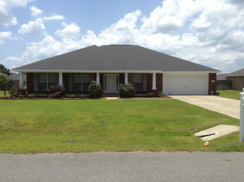 A Must See! This spacious 4 bed home with 3 baths is just right for a large family. This modern Ranch floor plan features a huge living room, dining room, office and a spectacular kitchen, Stainless steel range, microwave and dishwasher; Granite counter tops and large island. Master Suite separate side of the home has a large walk-in closet for her and a closet for him. There is a large covered porch off the great room perfect for relaxing or outdoor entertaining. In addition, A+ rated elementary, middle, and high schools are all located within 5 to 7 miles. Special features; custom shelving, tray ceilings, high ceilings, washer and dryer, pendant lighting. 7SFG(A) and Duke Field 16 miles. Located in PREMIER Brownston E. Manor Subdivision!