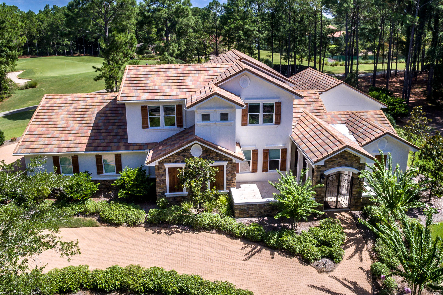 Awesome Golf Course home, settled on the Green of #13 and the Tee Box of #14 of The Raven. This spectacular home has it ALL including LAKE Views and lots of privacy!  Spacious open floor plan with french pattern Travertine floors downstairs and wood floors upstairs. Large spacious kitchen with cook top, double oven, 2 new Miele Dishwashers, Miele built in coffee/cappuccino/expresso maker and new Sub Zero refrigerator. Kitchen, living areas and master bedroom over look screened in saltwater pool & hot tub, SPF 15 screened in Lanai with UV protection in, while keeping pine straw out! Whole house generator (48KW) conveniently powers the entire home and pool and was just installed in 2019.  More features include: Cox Home Life Security, Sonos Sound, USB outlets throughout home, Audible alarm on doors, & all televisions stay. Two new HVAC units, new phenolic rust proof air handler & HVAC service and Termite bonds in place. Home equipped with in-wall pest control system, and exterior of home painted in 2019 with two-part elastomeric paint.  Enjoy the awesome Summer kitchen for those warm Florida days out by the screened in pool with tanning ledge. Beautiful water feature in courtyard. Guest room downstairs with walk in closet, private bath, and small kitchenette! Home is NOT in a flood zone! Please call listing agent with any questions!