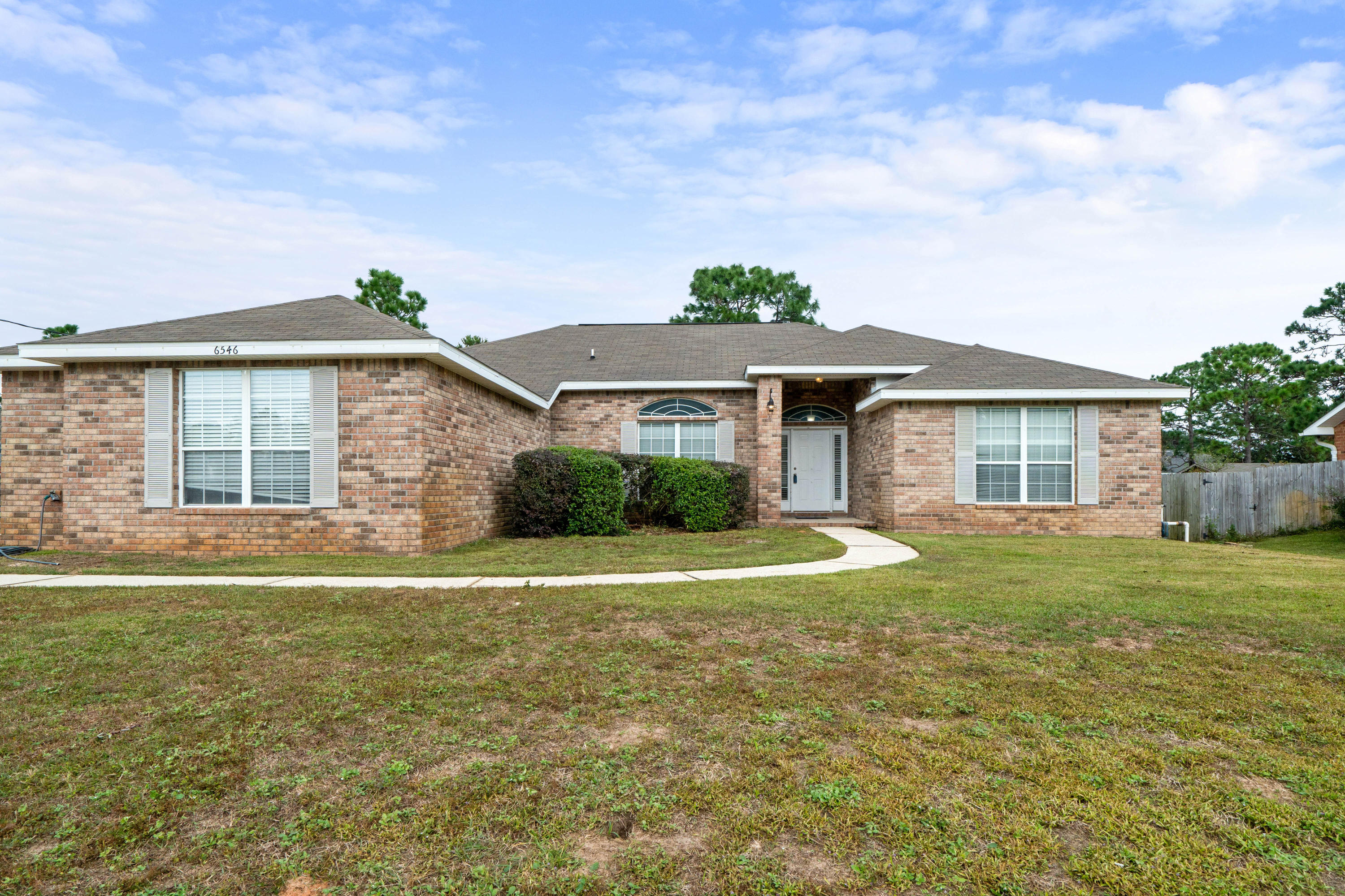 BEAUTY in Holley By the Sea! 4 Bed, 2 Bath, 2 car garage! **Open Concept** FRESH PAINT throughout, new flooring, updates throughout, screened in patio, large yard with FIRE PIT, large laundry room (with sink!), window treatments convey. Quiet and peaceful neighborhood, with plenty of square footage to *grow*! Large tub in master bath & split floor plan. MOTIVATED SELLER - Call your favorite agent today!