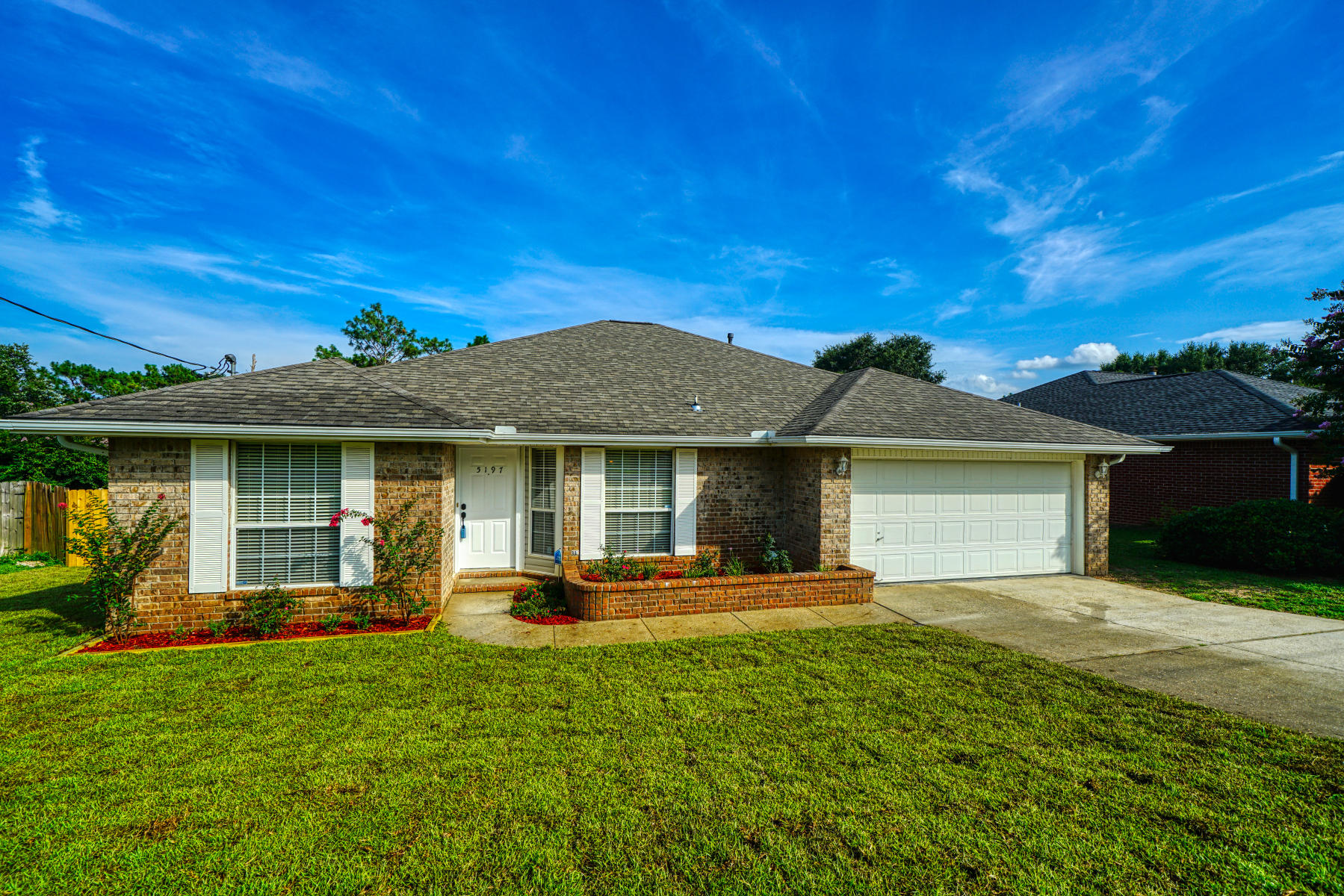 Beautifully remodeled home with a BRAND NEW ROOF, NEW LVP flooring, NEW interior paint! Both bathrooms have been remodeled with gorgeous shiplap walls and granite countertops. The beautifully designed kitchen features a brand NEW refrigerator, stainless steel appliances, and a gas stove overlooking the large living room which is perfect for entertaining. It has a modern split bedroom design that provides more privacy for the master bedroom and master en suite that has plenty of space with dual vanities. This home sits on a big front yard and an even bigger backyard with complete privacy behind you! The septic system lines have been completed replaced. This home has a lot of attention to details and is waiting for the perfect new owners to call this HOME:)    Check out the Matterport Tour!