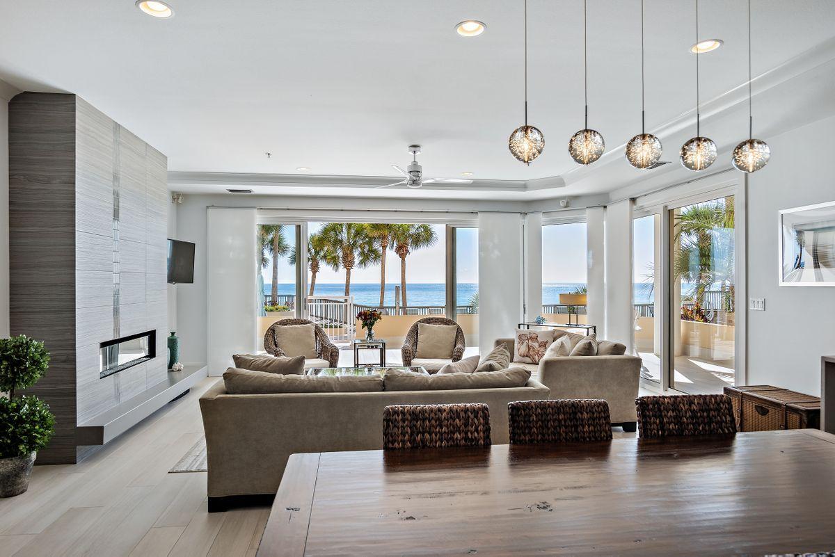 Live Inspired in this modern gulf front 3-bedroom condo in Hidden Dunes, a luxurious gated resort in Miramar Beach, Florida. Tasteful finishes, luxurious amenities, and panoramic gulf views are present throughout this completely remodeled residence. The design is exemplified in every feature including the spectacular fireplace, gulf front master suite, custom cabinets and quartz countertops in the gourmet kitchen, floating cabinets in each bathroom, and the spa-like master bath. The living space is complemented by walls of glass doors that lead to a wrap-around balcony space for maximizing the breathtaking gulf views, particularly at sunset. An outdoor gas grill and convenient access to the pool deck and beach access make this the most desirable location in Grand Villas. Hidden Dunes is a spectacular gated beachfront resort on 27 acres 
with walking paths winding through natural vegetation connecting cascading fountains, four pools, and fun sports courts include pickle ball courts, horseshoe pits and a lighted basketball court for playing in the cooler evening air. Owners enjoy swimming and relaxing in the amazing gulf-front pool and spa on expansive decks complete with entertainment bar and ice maker. A convenient walkway leads directly to the private deeded beach with chair and umbrella service. This rental-restricted community includes private security, a state-of-the-art fitness center, covered parking garages, and a grand community room for social events.