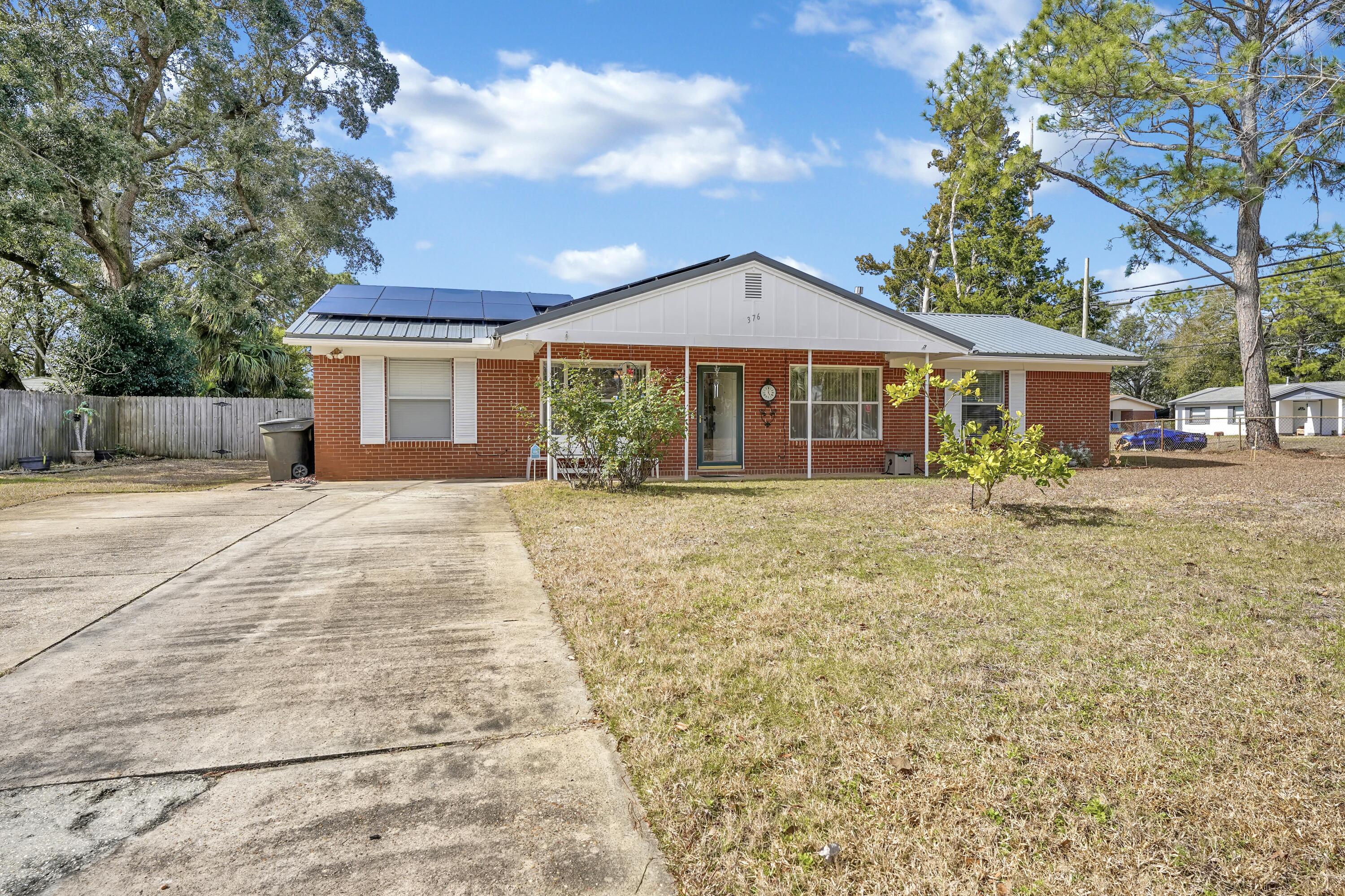 BACK ON MARKET!! Newly updated Guest Bath!! Spacious 4 Bedroom, 2 1/2 bath all brick remodeled home on a large corner lot with an in-ground pool in a great neighborhood. Pool was done in 2019. Solar was done in 2020. Interior features include: kitchen renovations in 2015-countertops and cabinetry, tile flooring and backsplash, appliances and kitchen island. This home has a nice open split floor plan. HVAC with duct work installed in 2014. Water heater in 2019. Metal Roof in 2020. Large laundry room with windows off the gathering room. Side yard has a place for an RV with waste and electric hook up. Back yard has covered patio with a nice dining and seating area to enjoy poolside fun. Entire lot has irrigation system. Work-shed has workbench and electricity and the lawn pump is inside, out of the elements. Backyard has privacy fence all around.