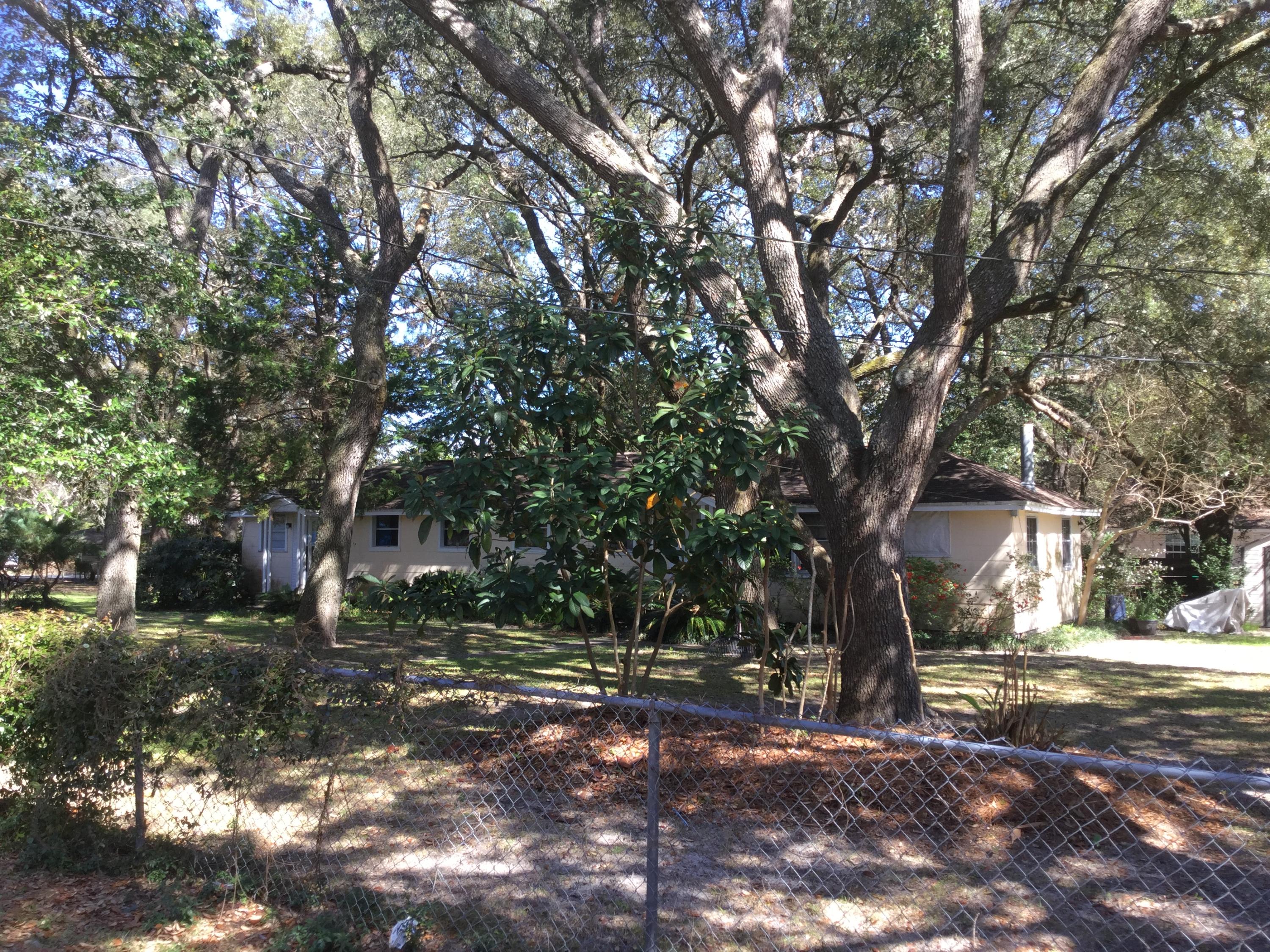 A rare find in the heart of Niceville. The property is being sold strictly for land value only. There are 3 lots included in this sale. The land is beautifully maintained with gorgeous mature oak trees. The 2 smaller Jim Walter Homes can be rented while you decide what you want to build. The home at the Hickory address is not livable and has asbestos siding. The property is being sold for land value only and includes the lot on 47th street as well as a lot on 48th street. Buyer is responsible for dividing of lots and doing all do diligence to their satisfaction.