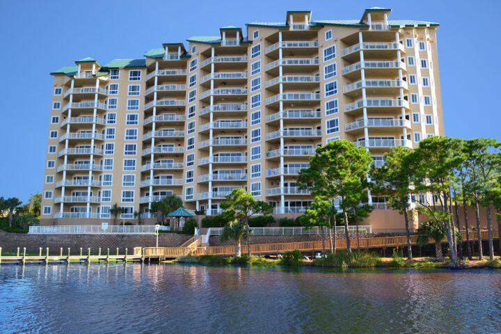 This is a short sale- subject to Lender/ Bank Approval.  This condominium is being offered in its current condition and reflects deferred updates and modernization needs consistent with a property that has not been updated int 15 years.   Recent appraisal classified the property as C4 condition.   This penthouse unit has four bedrooms, each with it own bathroom.  The kitchen is open space with small pantry but has original appliances.  The upstairs has a built in bookshelves with pool table.  This penthouse does not have a boatslip. The inspection report  and contractor renovation estimates are available for review.  Buyer to verify all details and measurements.  No Short Term Rentals Grand Harbor also offers residents access to a range of amenities, including a sparkling swimming pool, fitness center, and a pier for boating enthusiast concierge services.   This unit is situated in the highly sought-after Grand Harbor community with no short term rentals.  It is easy access to Destin's finest shopping, dining, and entertainment options.  With the harbor just steps away, you can immerse yourself in the vibrant coastal lifestyle, with boating, fishing, and water sports right at your doorstep.