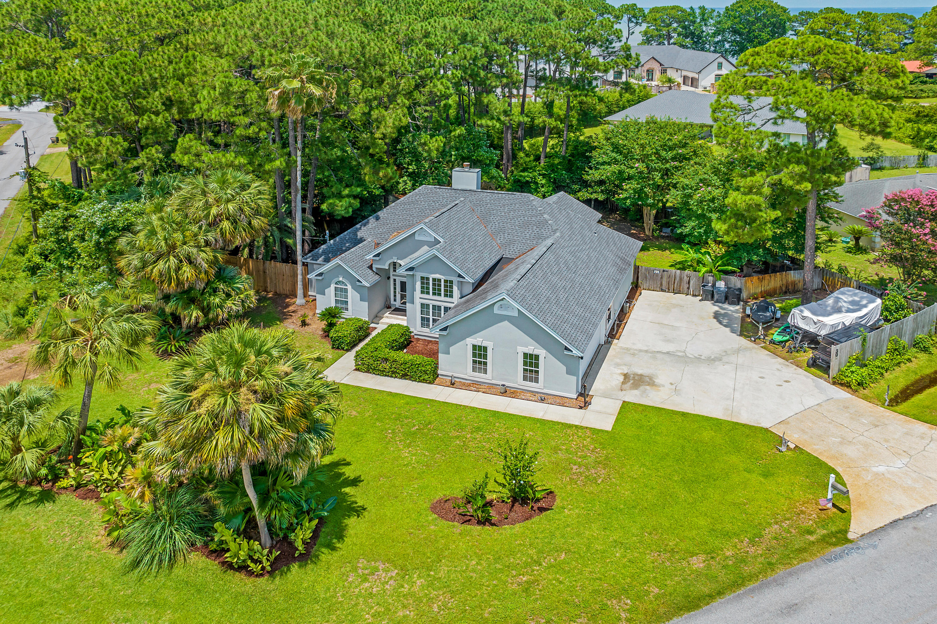Looking for a 2nd home with room for a pool that you can rent out when not using? This house checks those boxes! Excellent Miramar Beach location with tons of privacy that is also the perfect fit for a primary residence. Flood Zone X so no Flood Insurance required. No HOA  - Over 1/3 Acre -  Corner Lot - Room for Boat, Jet Skis & RV - Short Term Rental Capable - Minutes to Neighborhood Parks, Boat Launch & Beach...Gorgeous 3BR/2BA home in the popular Holiday Shores Estates community in Miramar Beach. Excellent layout maximizes space, the high ceilings & tall doorways give it a spacious airy feel & large windows with transom windows provide an abundance of natural light. Outstanding features include a seperate den that could be used as an office, library, playroom or formal dining room, a split floorplan with huge primary bedroom & sitting area, custom built closets in all bedrooms, open kitchen with breakfast bar, wine chiller, stainless appliances, beautiful hardwood floors, 2 HVAC systems,2 hot water heaters, a large Florida Room with tons of windows overlooking the backyard and a 2 car garage. Situated on a 0.33 acre corner lot backing up to a serene wooded parcel, this lot offers rare privacy & plenty of room for all of your "toys" as well as the possibility of adding a pool or hot tub to expand your outdoor enjoyment plus there is an electric hook up for an RV. Great short term rental capability! Located in Flood Zone X so no flood insurance required. Quick access to Parks & Rec...Paradise Park 1 minute, Legion Park Boat Launch - 2 Miles, Haugen Bayfront Dog Friendly Park 1/2 mile, Miramar Beach Regional Beach Access - 1.9 miles - all accessible without having to get on Highway 98! Take your golf cart from N Holiday & cross at the light to S Holiday Road to get to Scenic 98. You can make your way all the way to the Destin Harbor on back roads without getting on Hwy 98. Additionally, unlike some neighborhoods in the area, there are multiple ways to get in and out of the neighborhood with a traffic light. Don't miss this special property, schedule your showing today!
