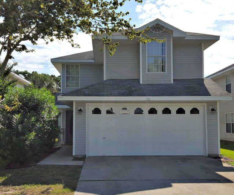 Lake front home located in the desirable Twin Lakes Estates Subdivision with 3 bedrooms/2.5 baths. Master Bedroom on Lake side with views! The home offers an open floor plan with the kitchen opening to both the dining area and living room. Twin Lakes is a lovely neighborhood in the heart of Destin. There are nature walking paths and a playground with picnic area to enjoy. Buyer to verify all dimensions.