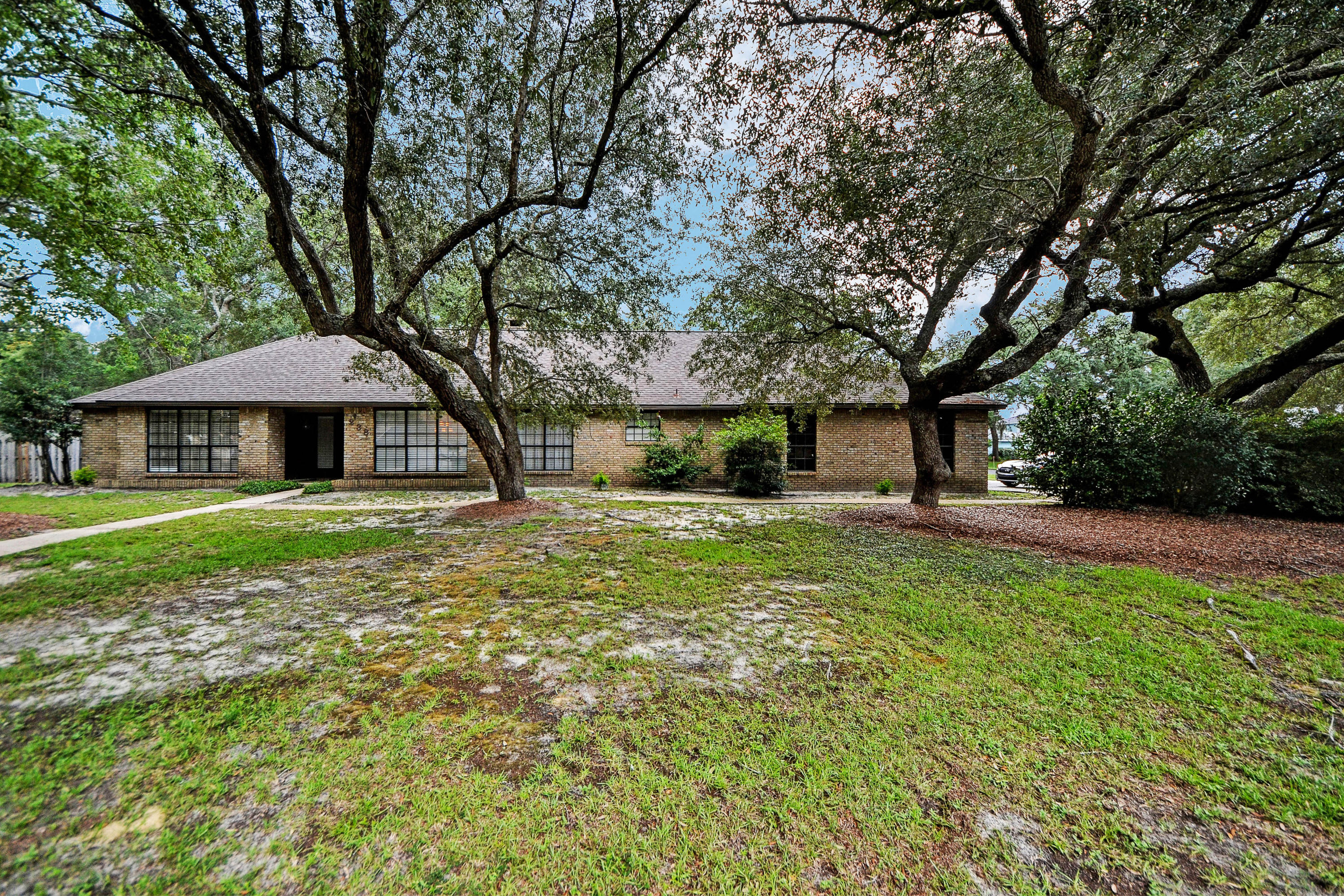 All Brick 3 Bedroom 2 Bath 2766 SF home located in the Popular Blue Water Bay Area. Home Features a 3 Car Garage, Corner Lot, Formal Dining Room, Wood Burning Fireplace, Wet Bar, Vaulted Ceiling, Large Bedrooms & Closets, Huge Master Bedroom & Master Bath with Separate Shower and Jacuzzi Bath, Walk Through Closet with Access to Laundry Room and a Gigantic Heated and Cooled Florida Room. The Kitchen Features a Granite Counter tops, High end Stainless Appliances, Built in Oven and Microwave and Plenty of Counter and Cabinet Space. This home is in Excellent condition. Roofer replaced in 2013. Owner has a Termite Bond as well as a Survey. Priced to Sell! Call your agent today to schedule a showing. Close to shopping and Entertainment. All Room Sizes, ages and Measurements are approximate. Please verify if important.
